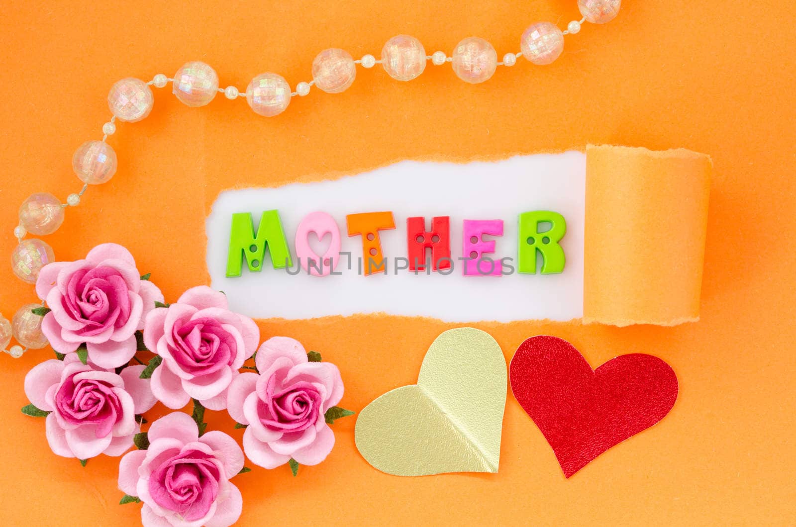 Mother word and pink rose with heart paper on color background.