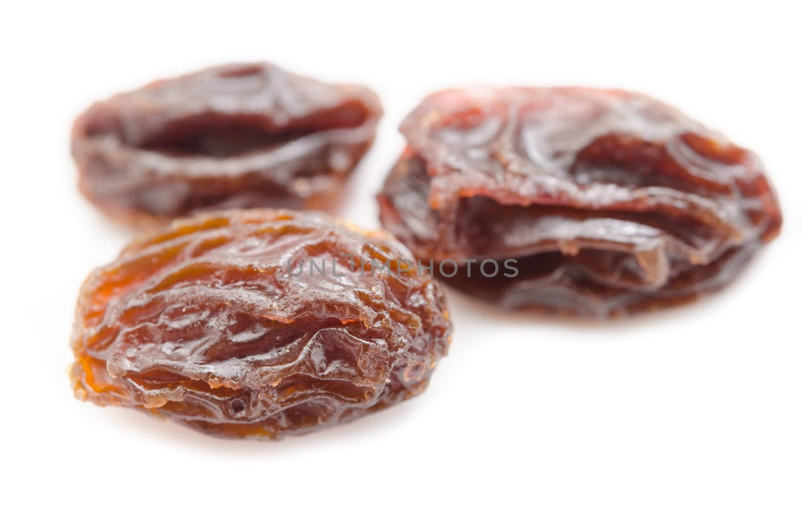 Close up of Raisins on whtie background.