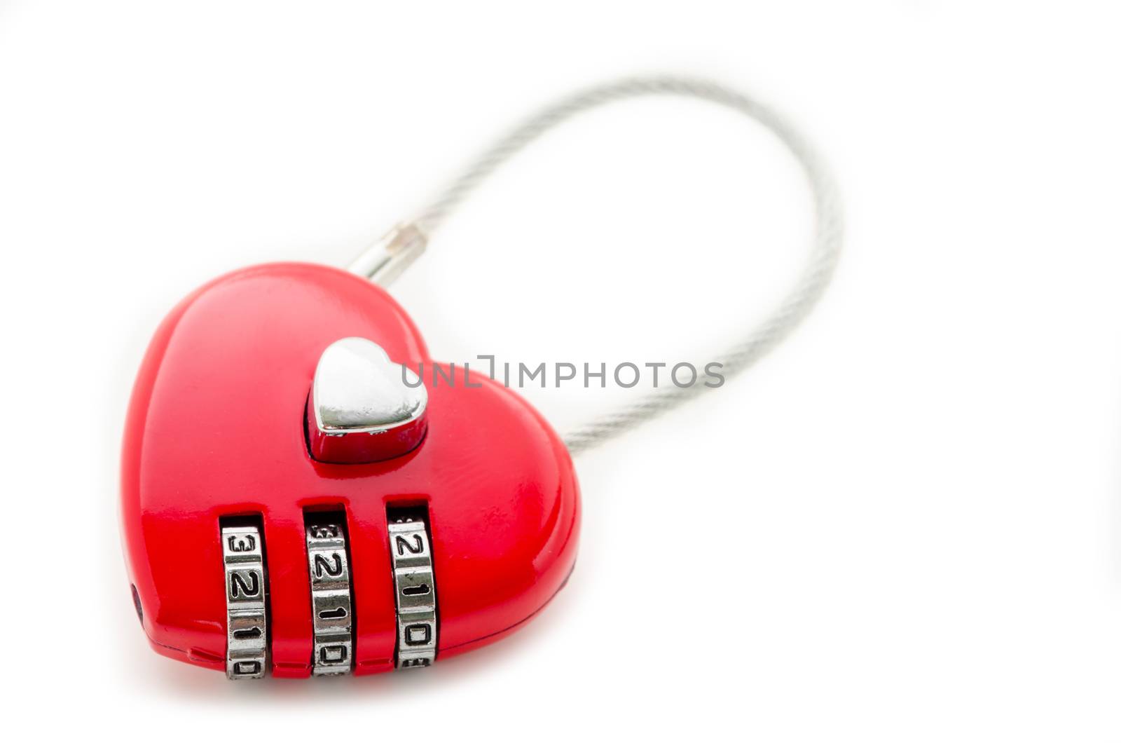 Red master key heart shape lock on white background.
