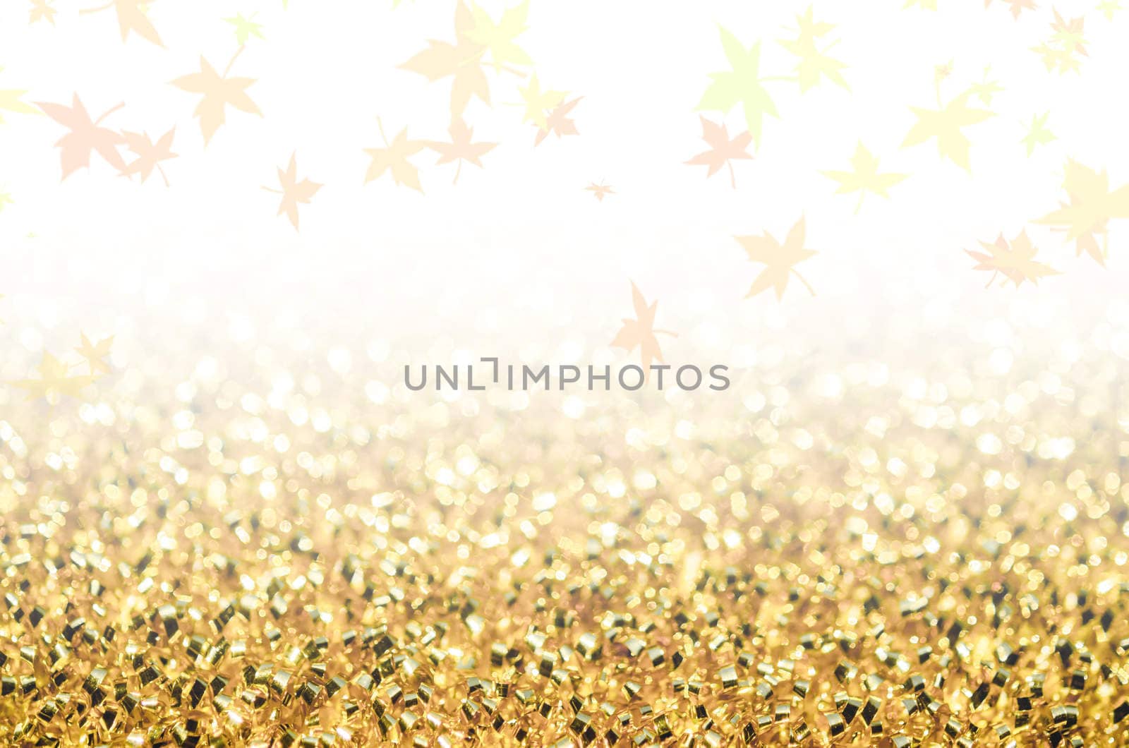 Abstract gold background with maple leaf.