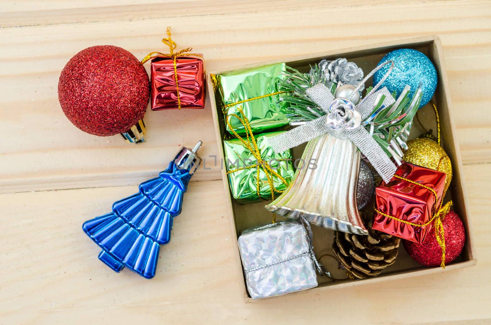 Christmas decoration in box on wood background.