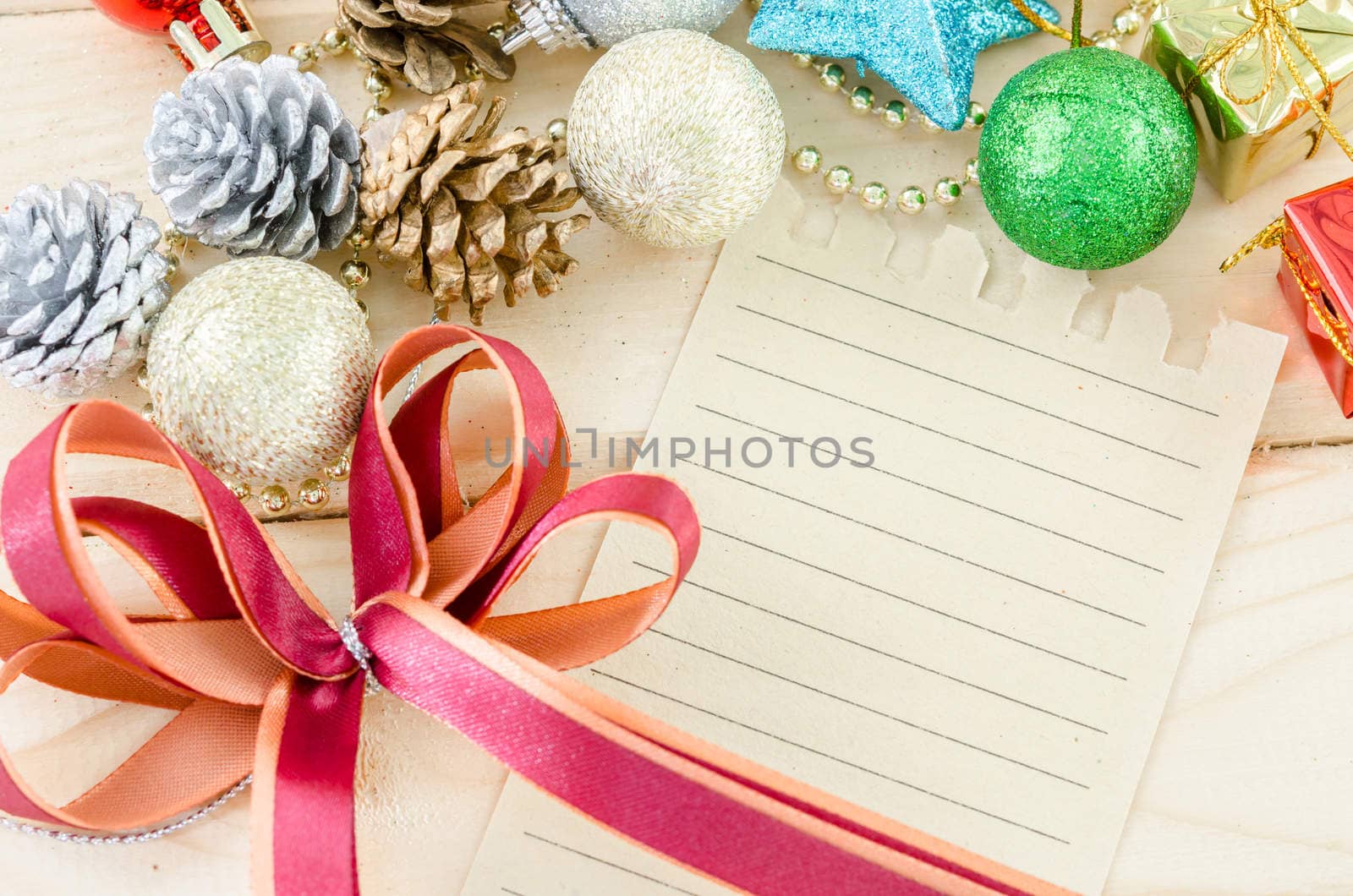 Blan brown paper for your text with red ribbon and christmas dec by Gamjai