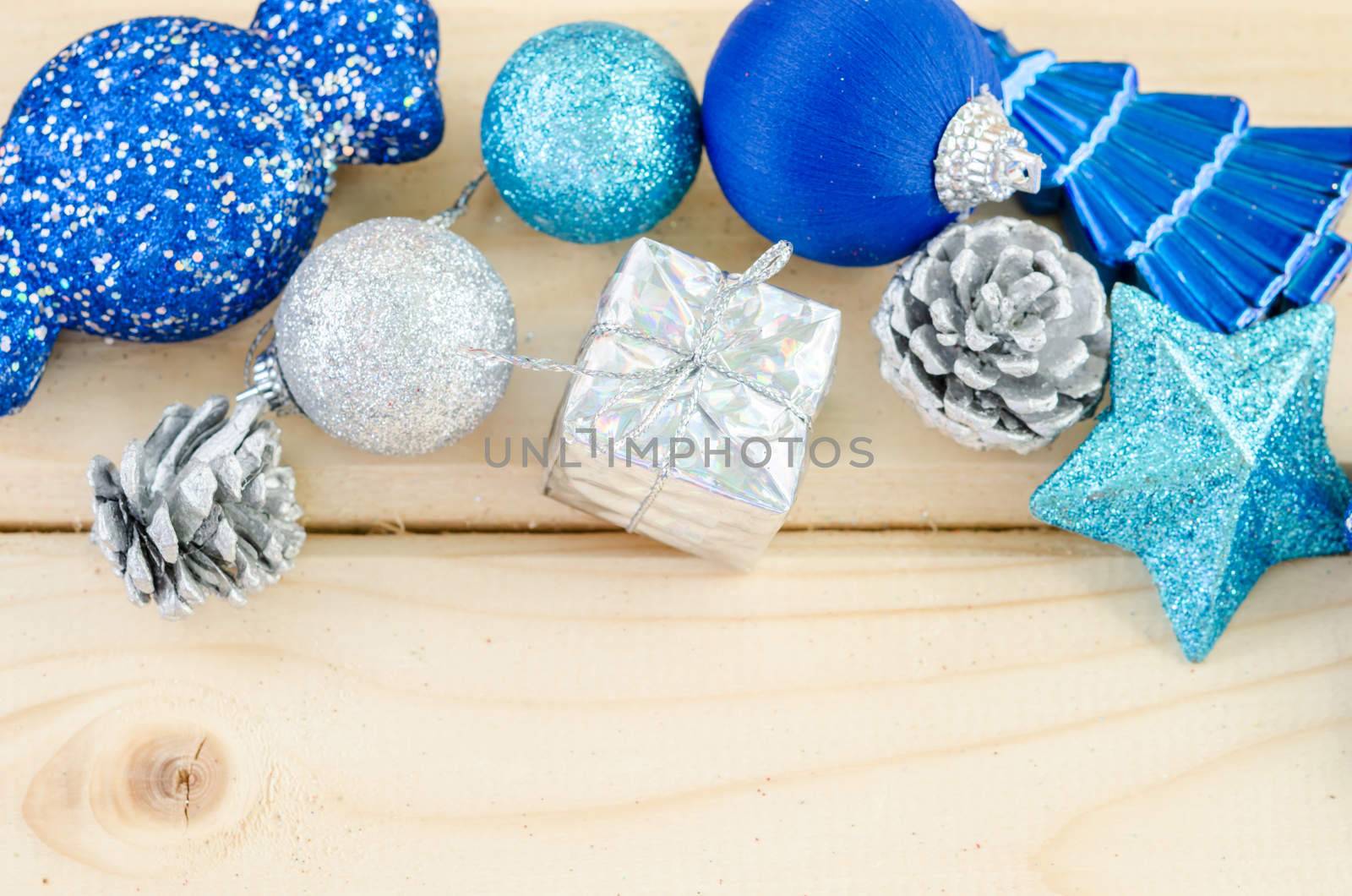 Blue christmas decorations on wooden background.