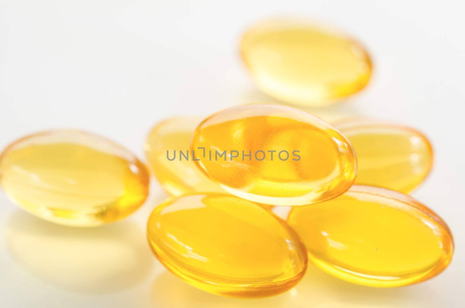 Fish oil isolated on white background by Gamjai