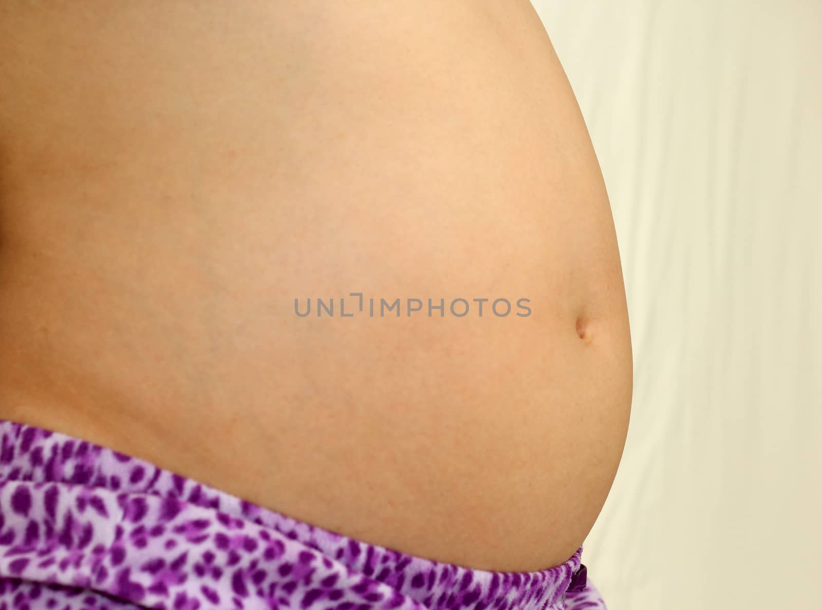 Photo of a cute pregnant woman belly