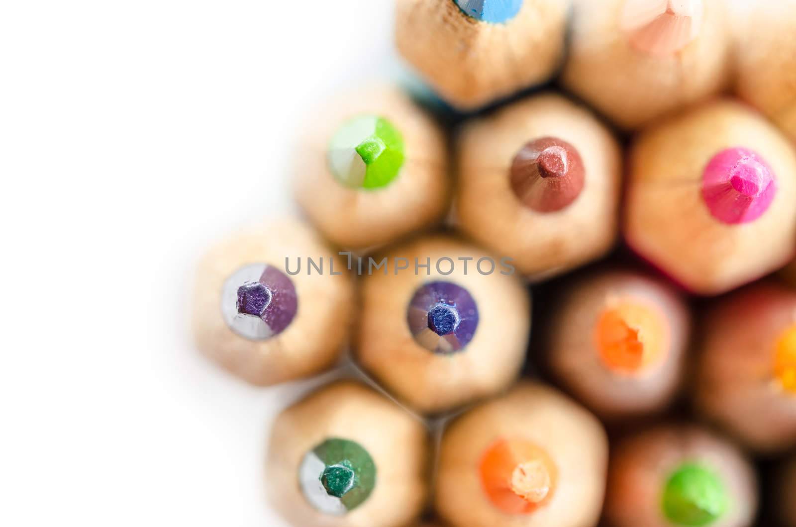 abstract composition of a set wooden colour pencils and space for your text.