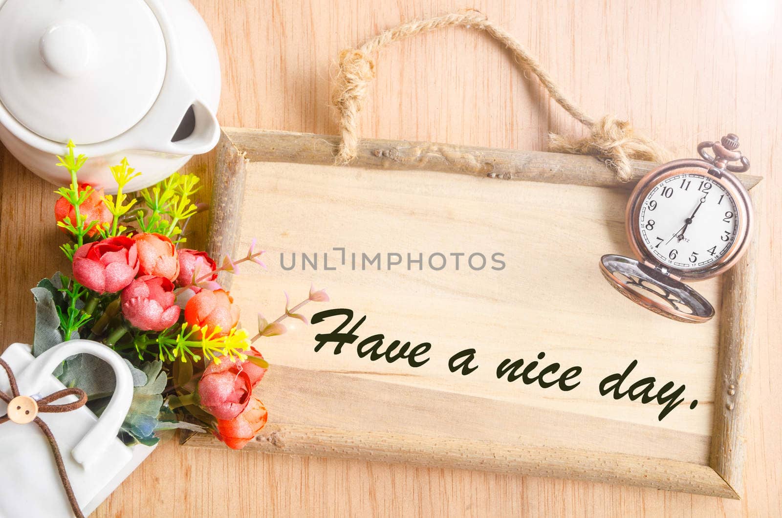 Have a nice day text in blank wooden photo frame by Gamjai