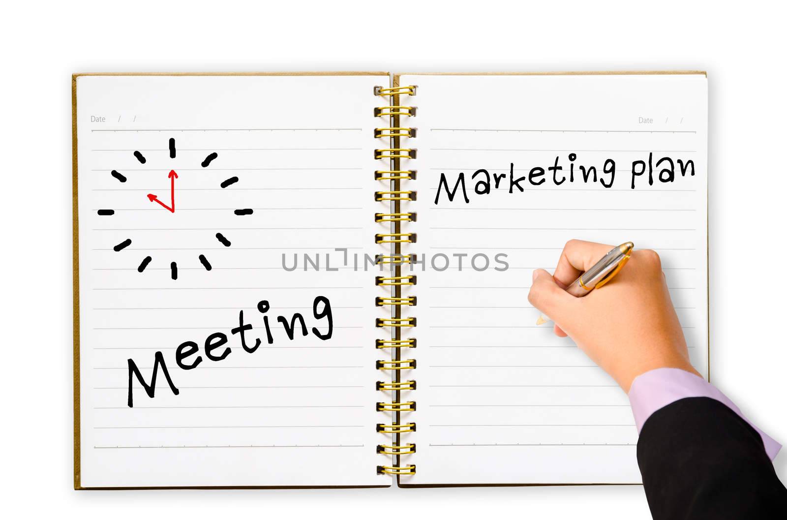 Hand of business man writing meeting market plan and clock symbol in open notebook on white background.