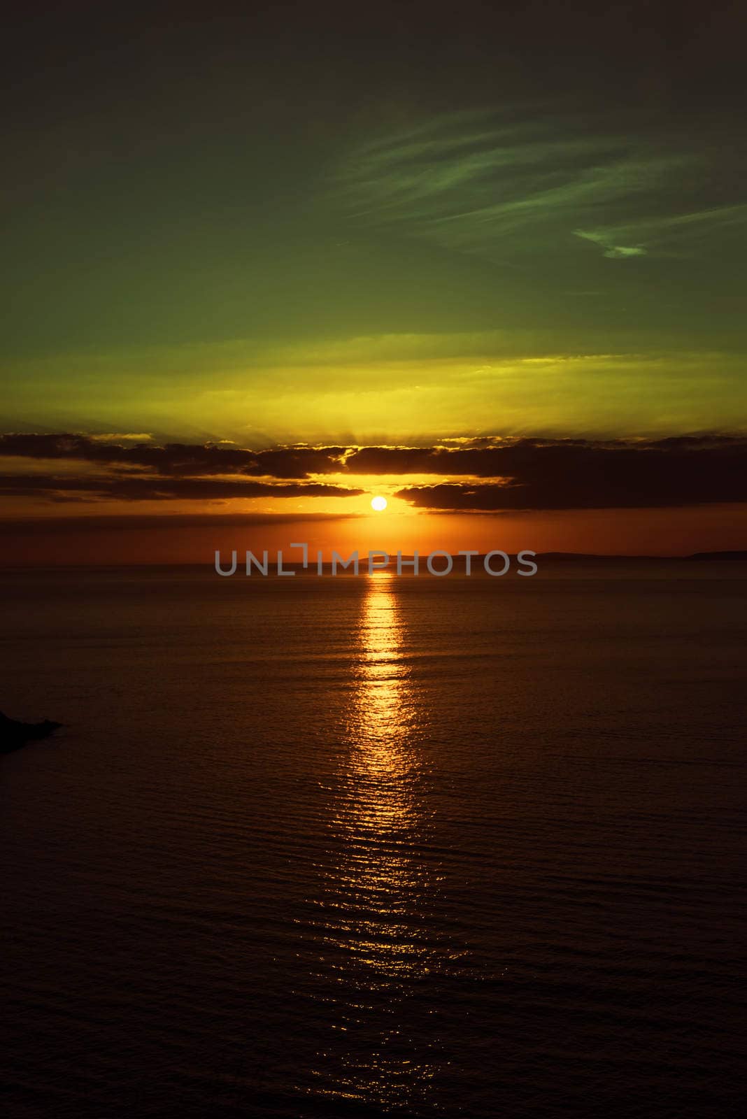 beautiful dark yellow sunset on the wild atlantic way in ireland