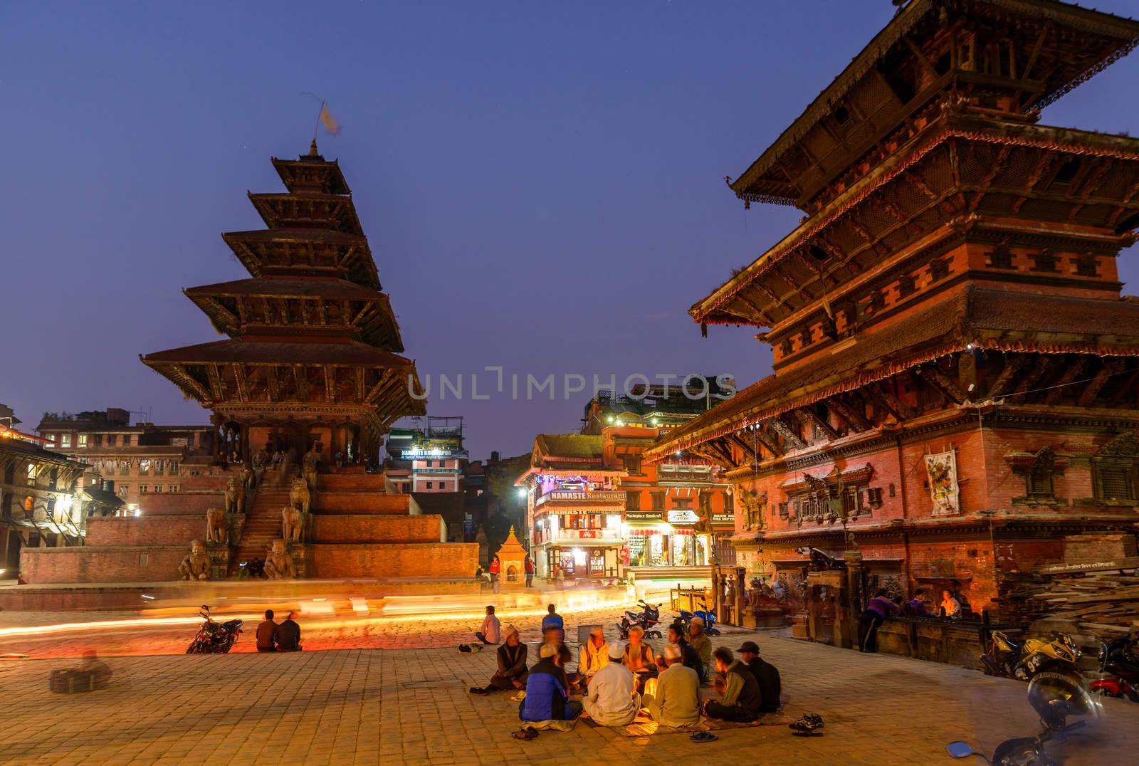 BHAKTAPUR, NEPAL - NOVEMBER 15, 2015: Taumadhi square at night with Nyatapola temple on the left and  Bhairavnath temple on the right.