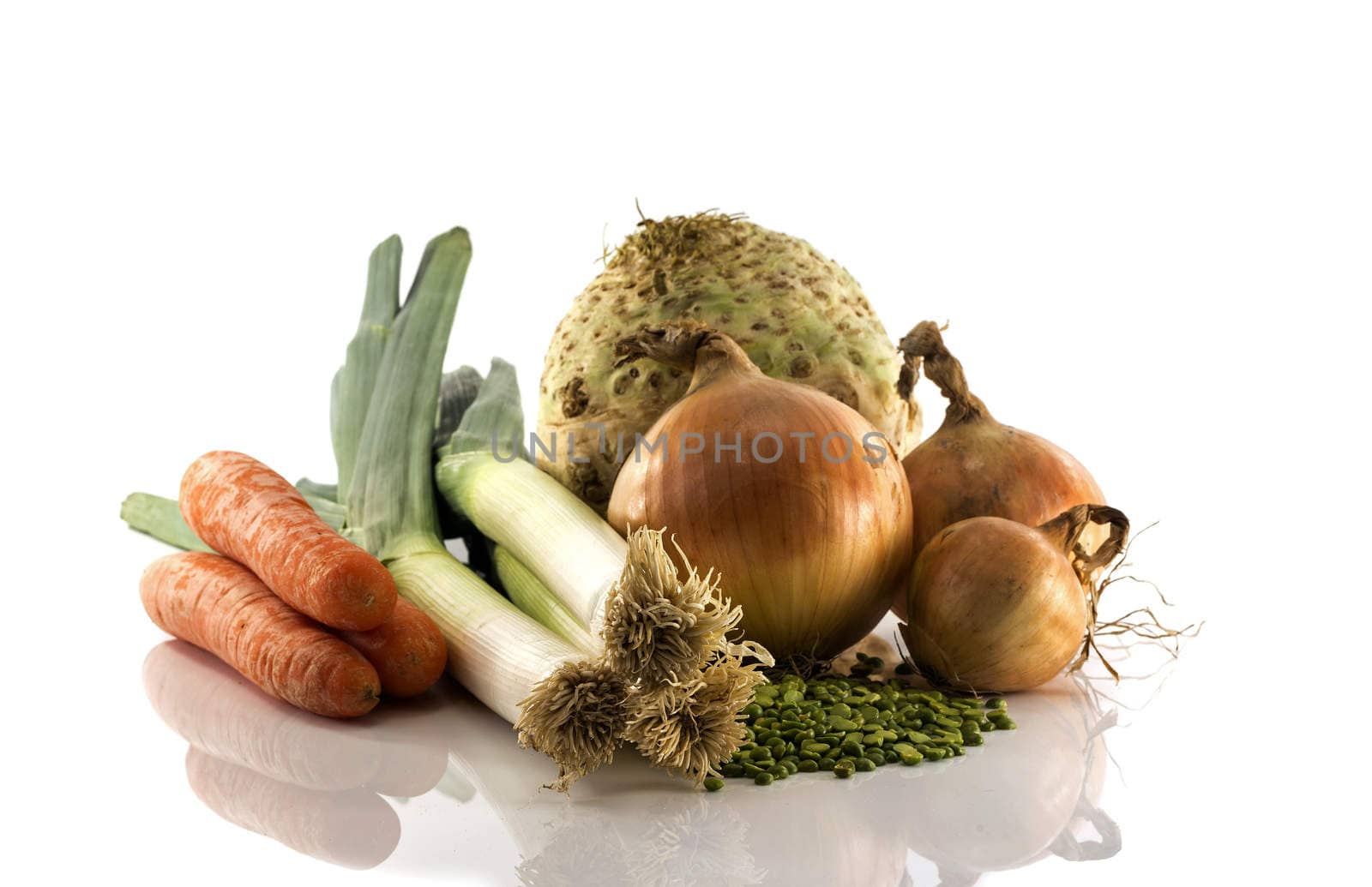 onion carrot and other ingredients for a soup isolated on white background