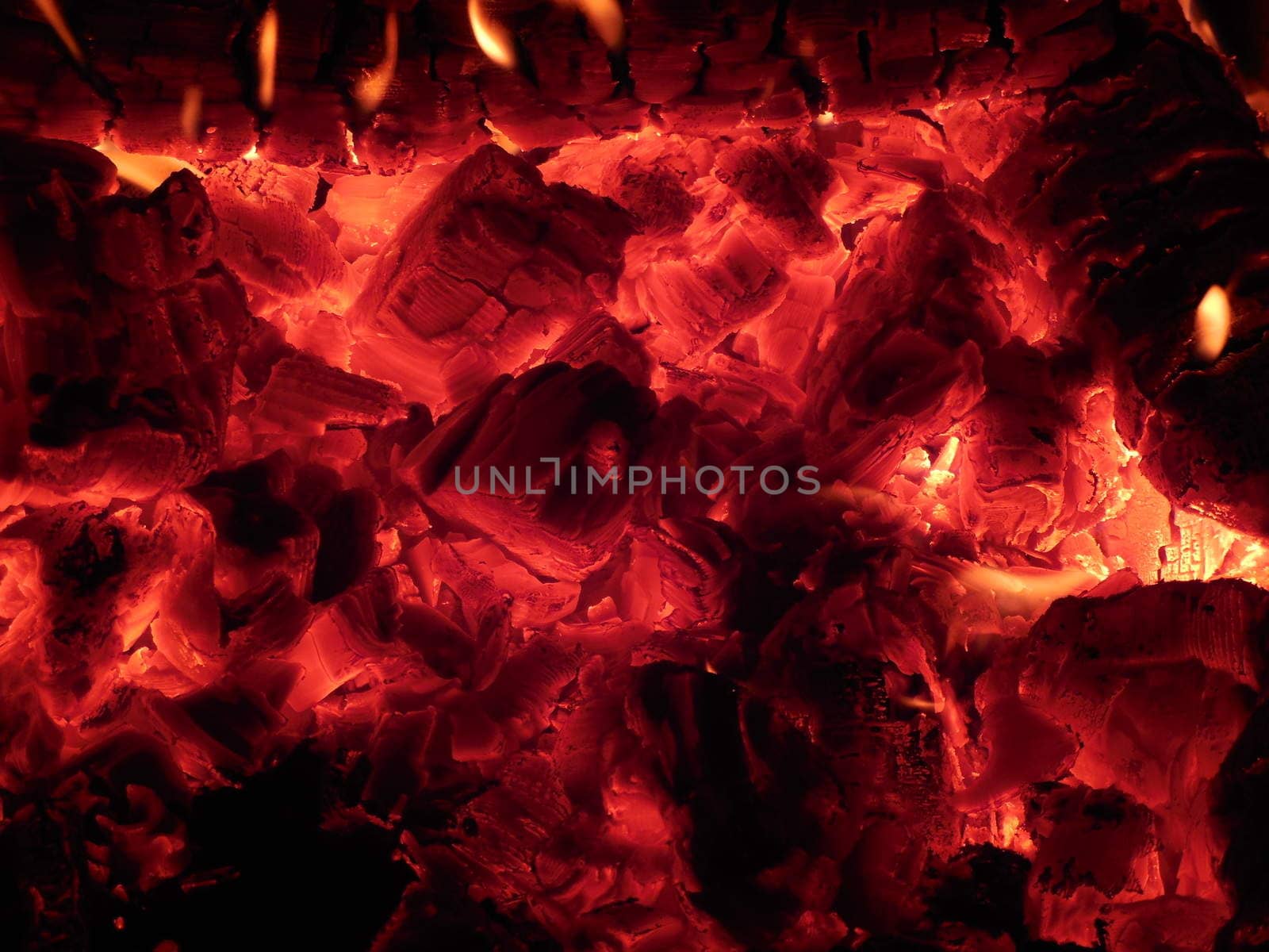 embers and the fire in the stove in Russian Karelia, February, 2015 by olga_ovchinnikova