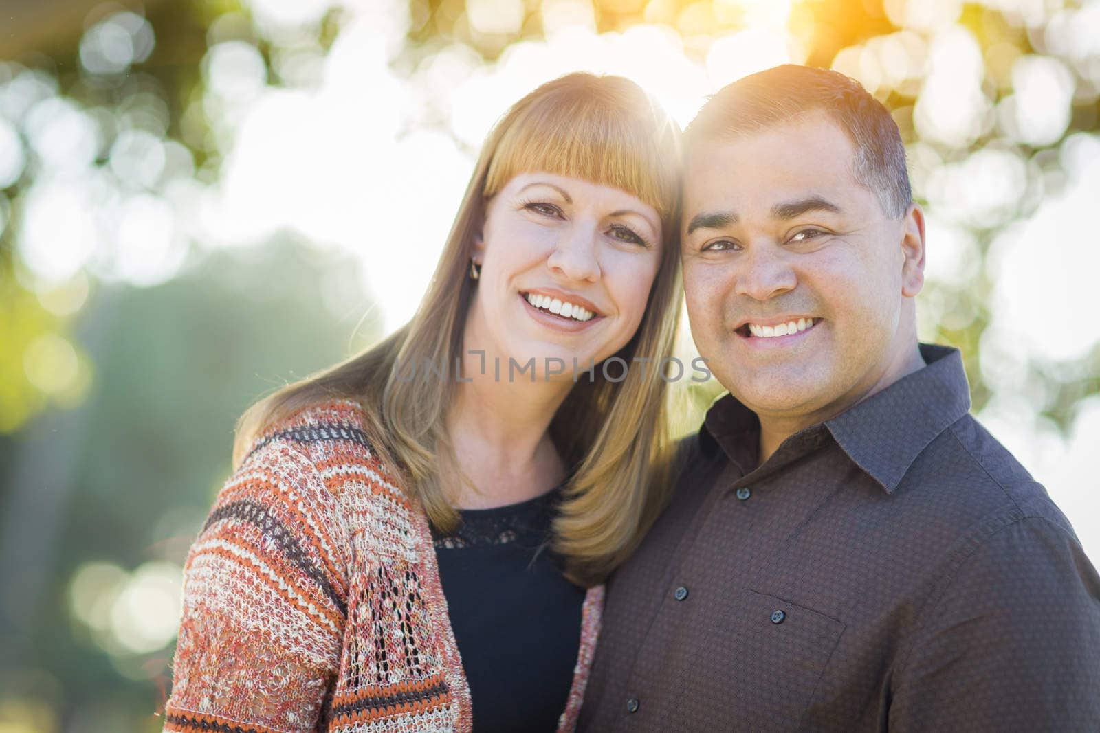 Young Loving Mixed Race Couple Portrait Outdoors.