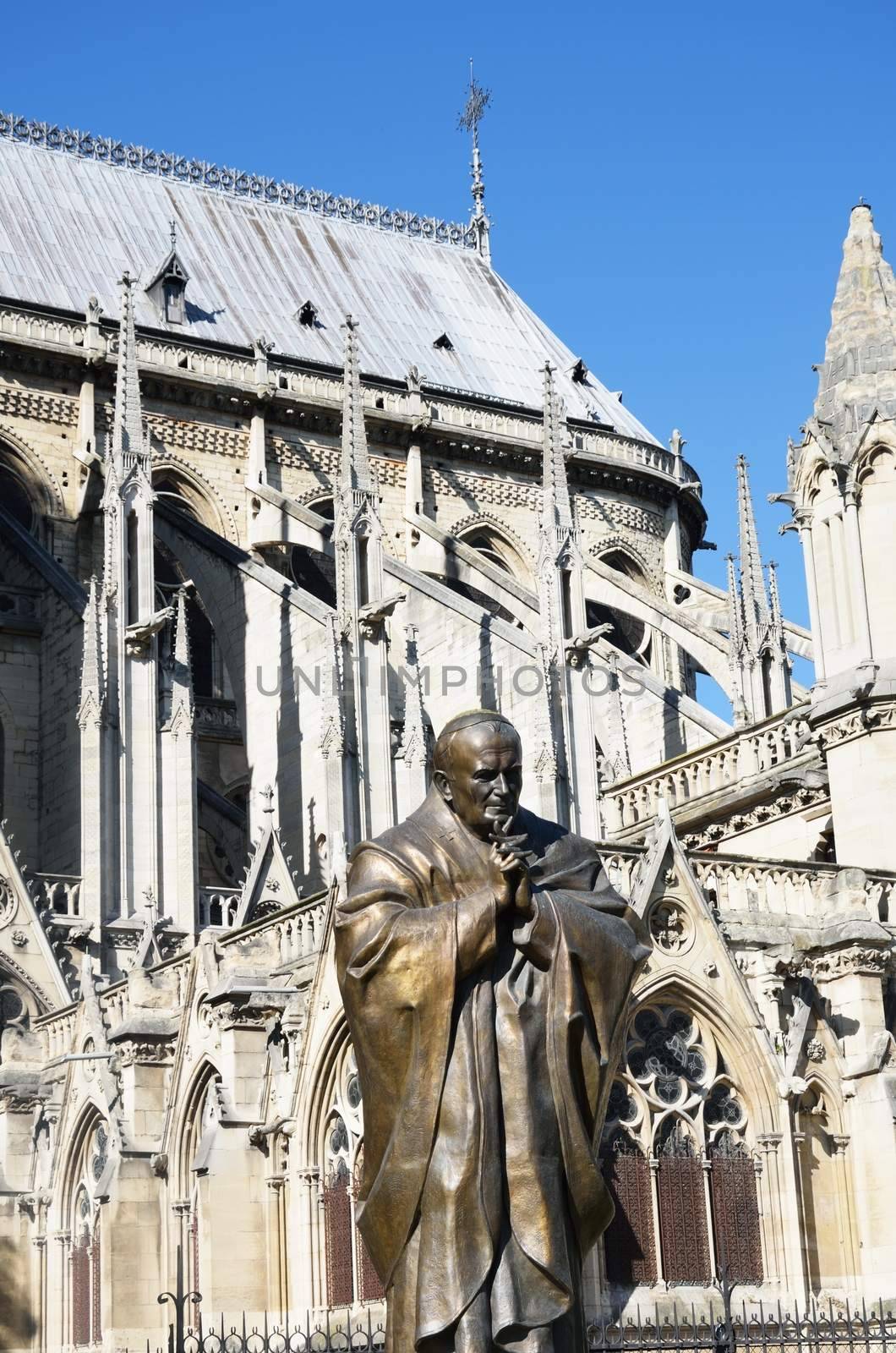 Statue of John Paul II with Notre Dame in Background