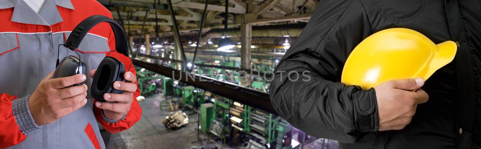 Workers with safety uniform at industrial factory