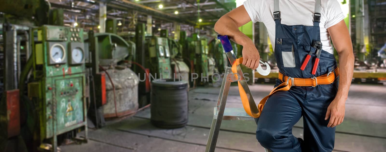 Worker with instruments at industrial factory