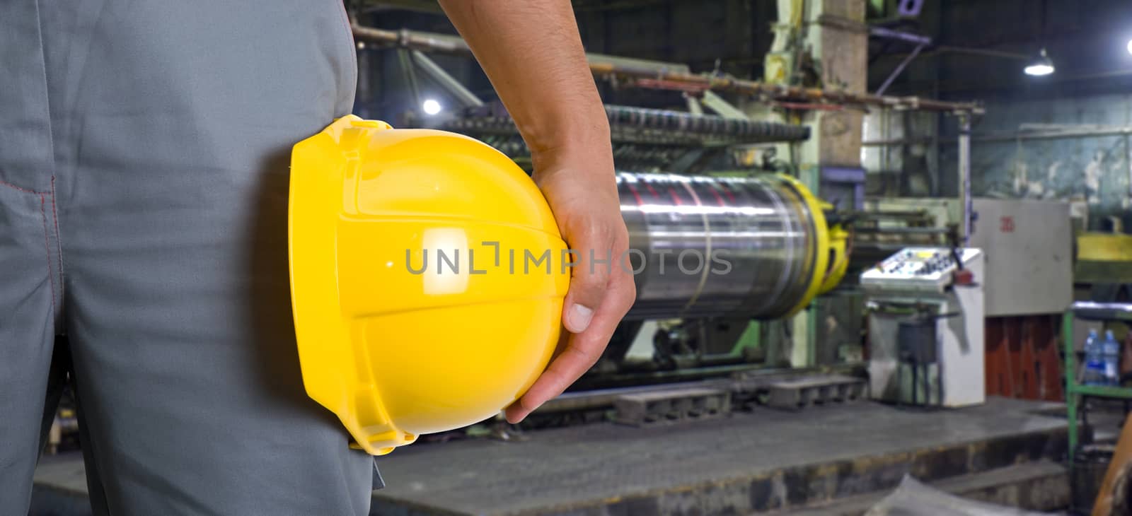 Worker with safety helmet at industrial factory