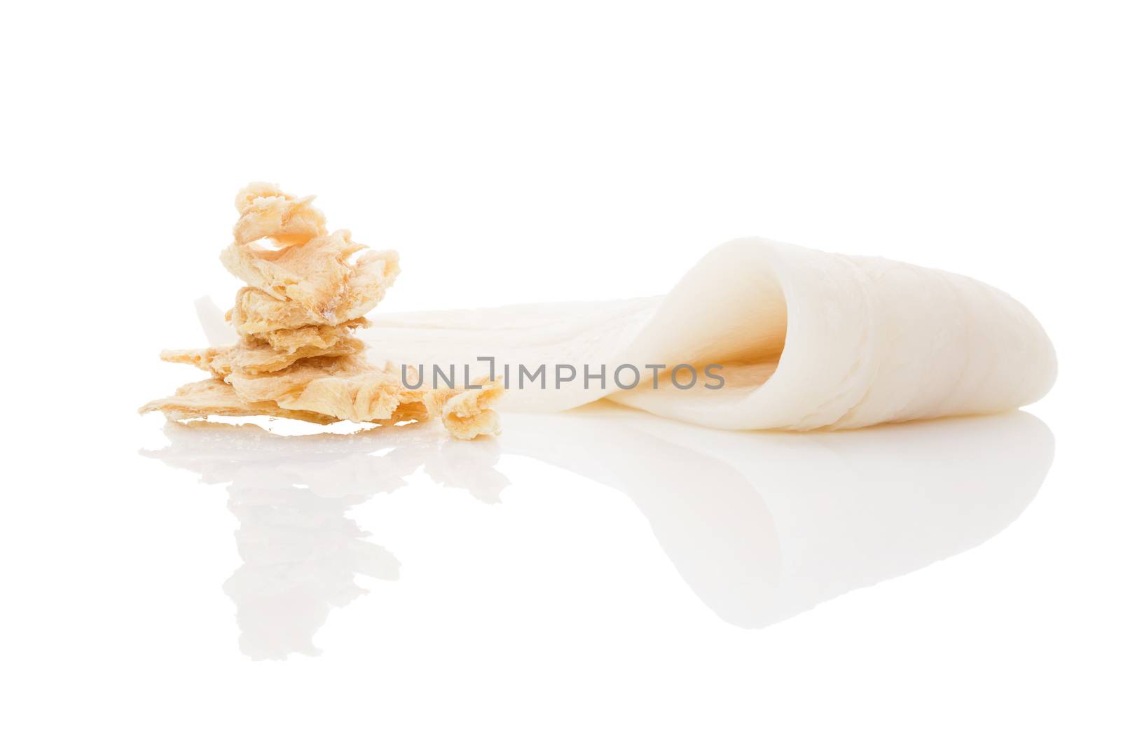 Fresh halibut fillet and dry fish snack isolated on white background. Culinary seafood eating. 