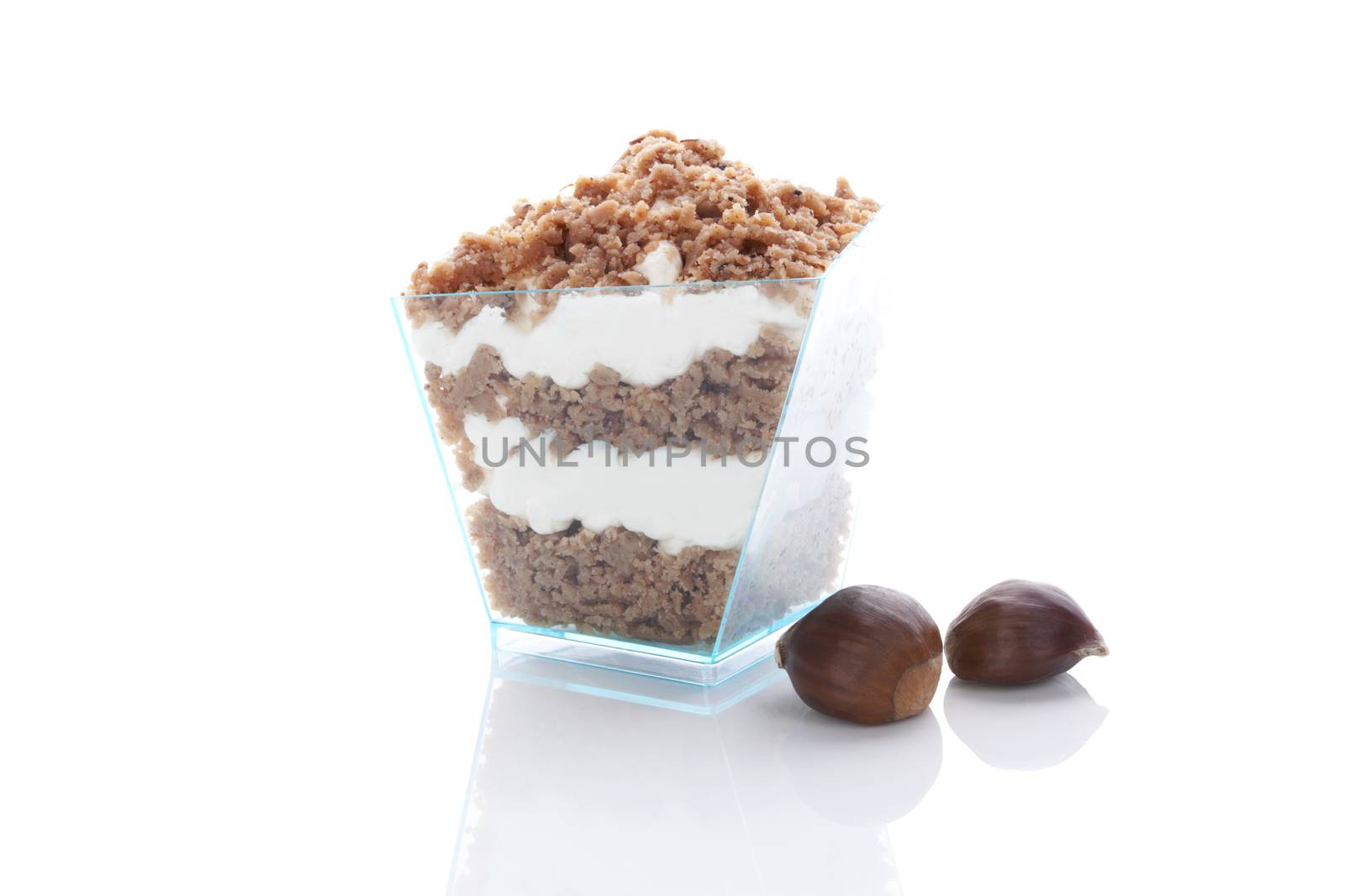 Chestnut puree dessert in glass and chestnut isolated on white background. Culinary sweet dessert eating. 