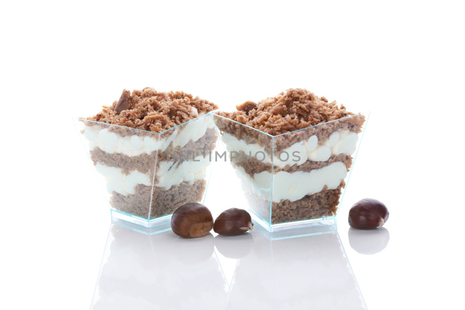 Chestnut puree dessert in glass and chestnut isolated on white background. Culinary sweet dessert eating. 