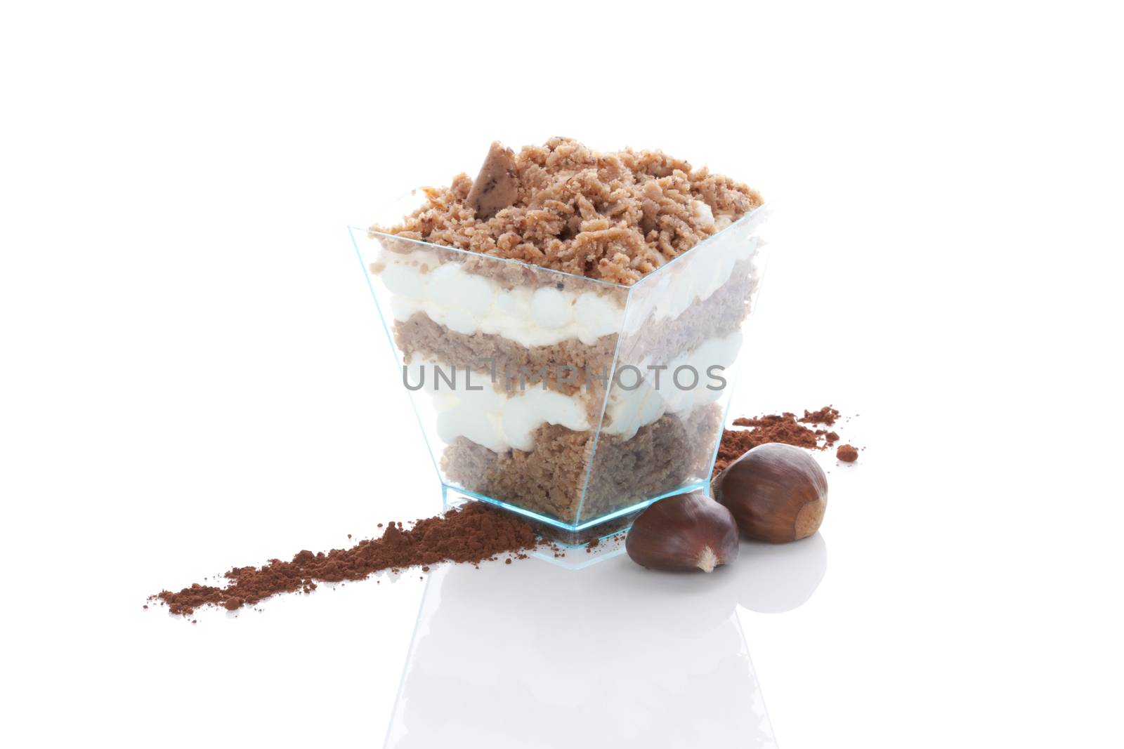 Chestnut puree dessert in glass and chestnut isolated on white background. Culinary sweet dessert eating. 