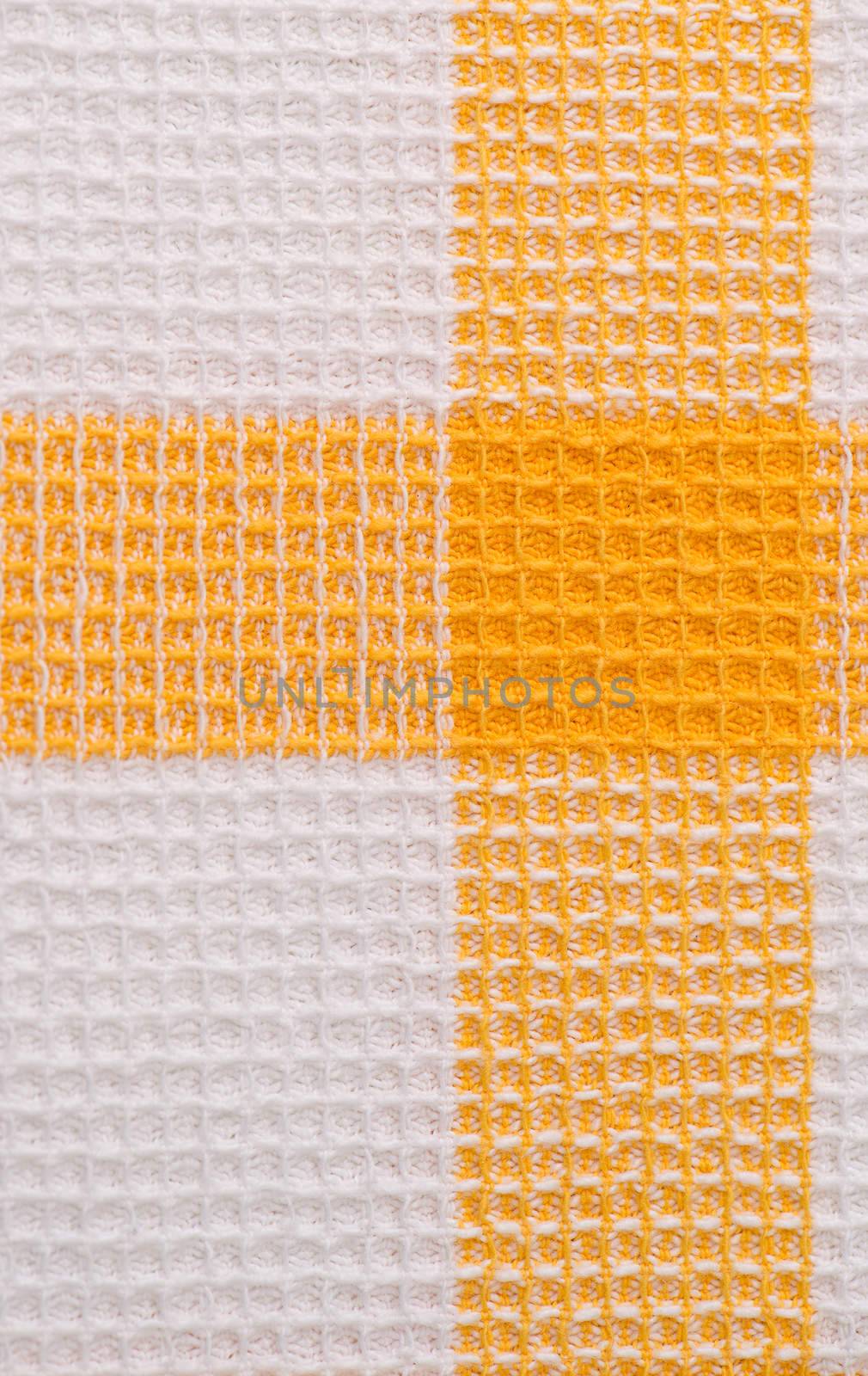 Closeup of yellow fabric texture background.