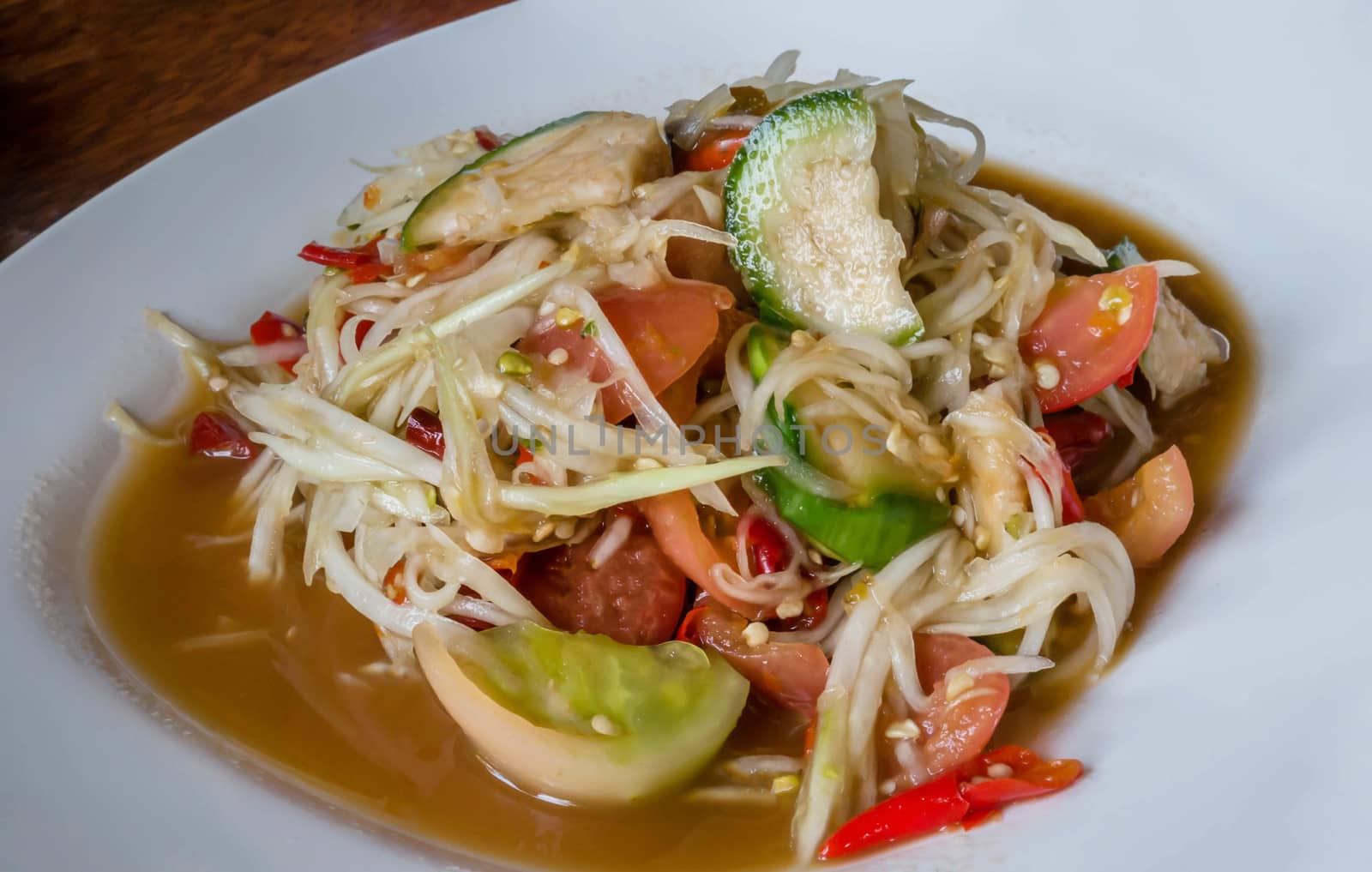 Famous Thai food, spicy papaya salad or "Somtum" in Thai