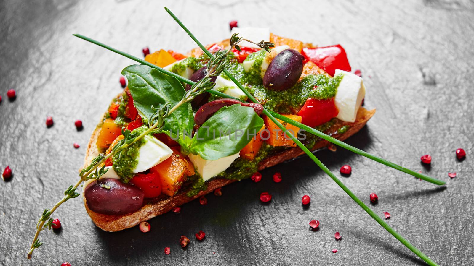 Bruschetta with roasted pumpkin, red pepper,pesto and cheese