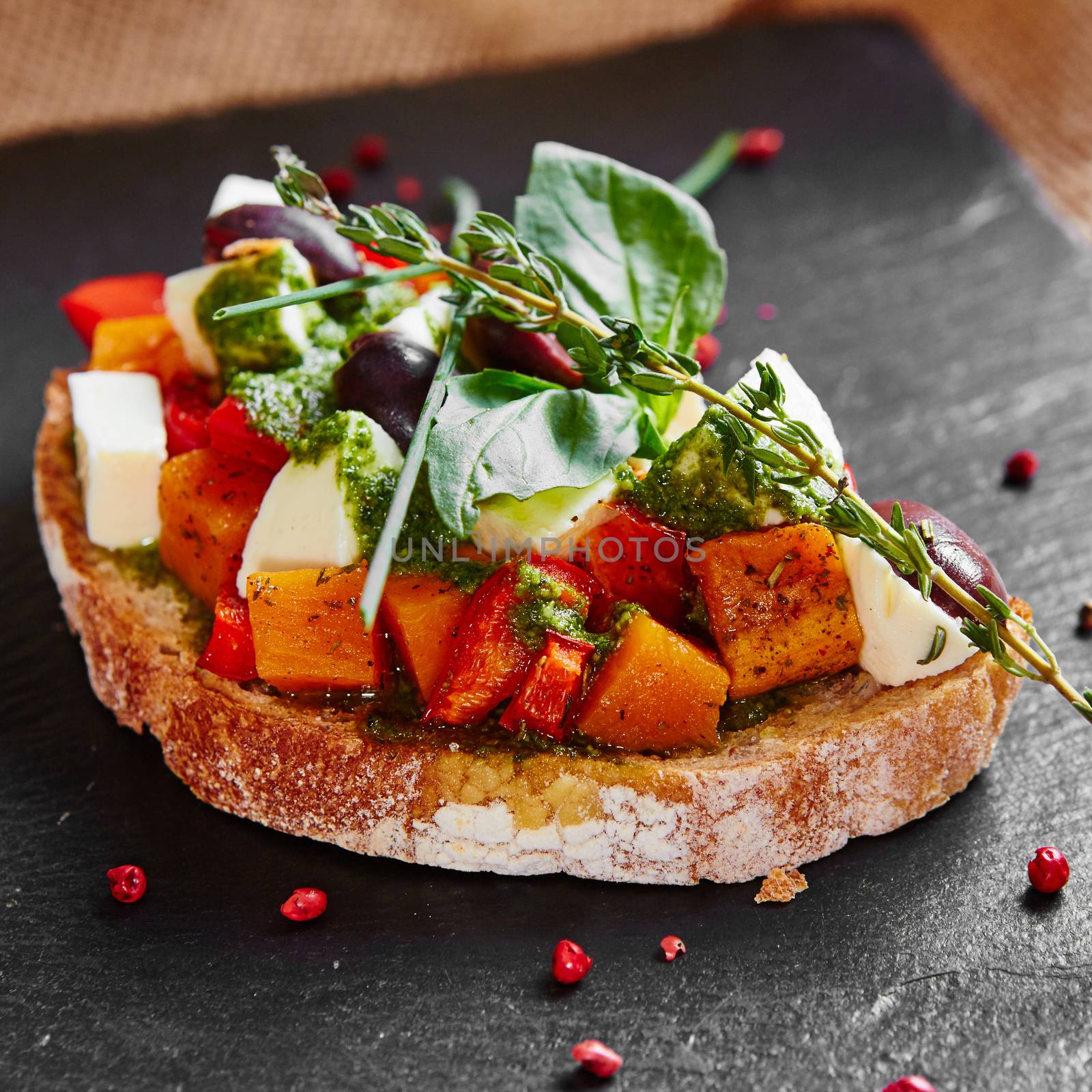 Bruschetta with roasted pumpkin, red pepper,pesto and cheese