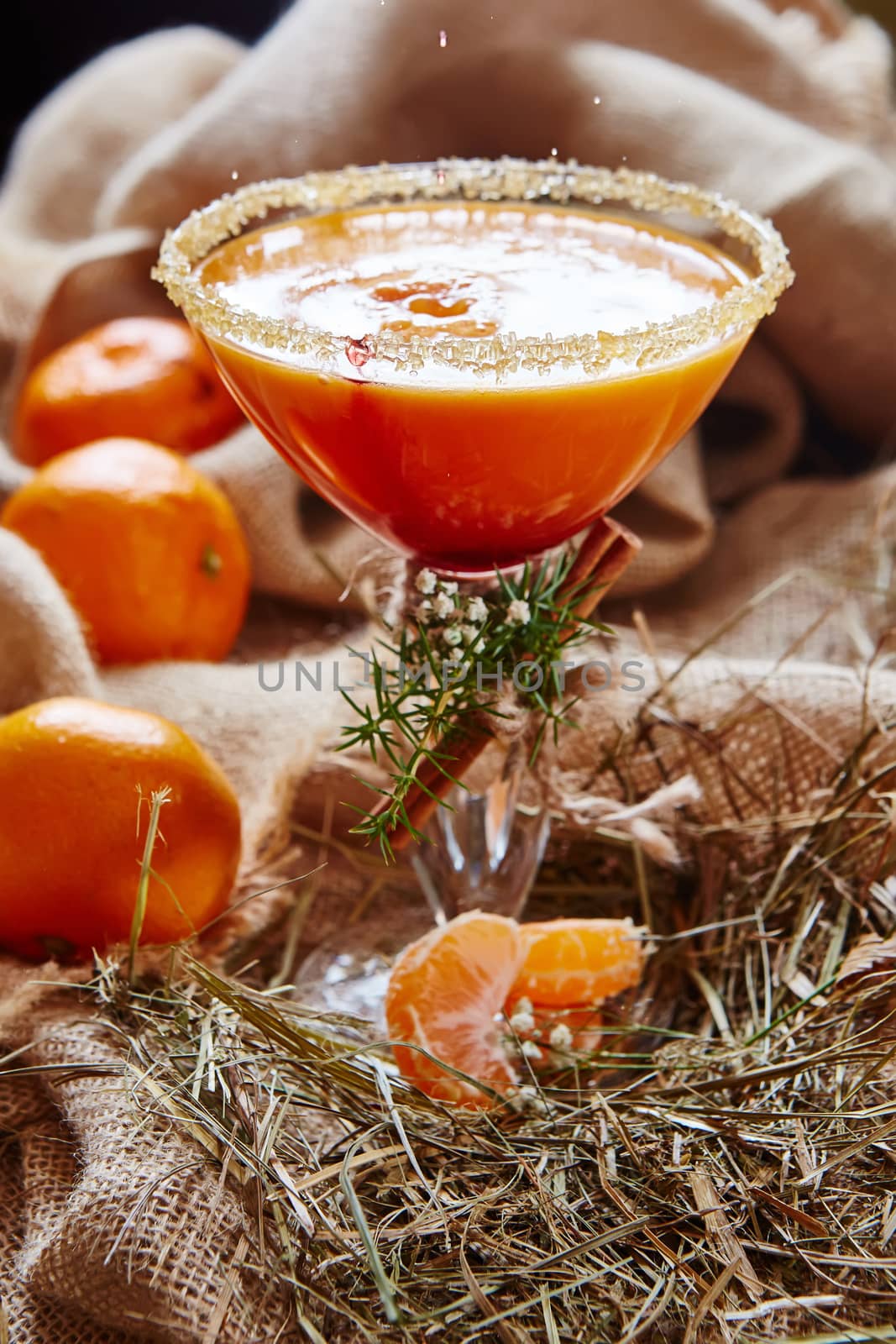 Fresh juice of ripe mandarins in glass. selective focus