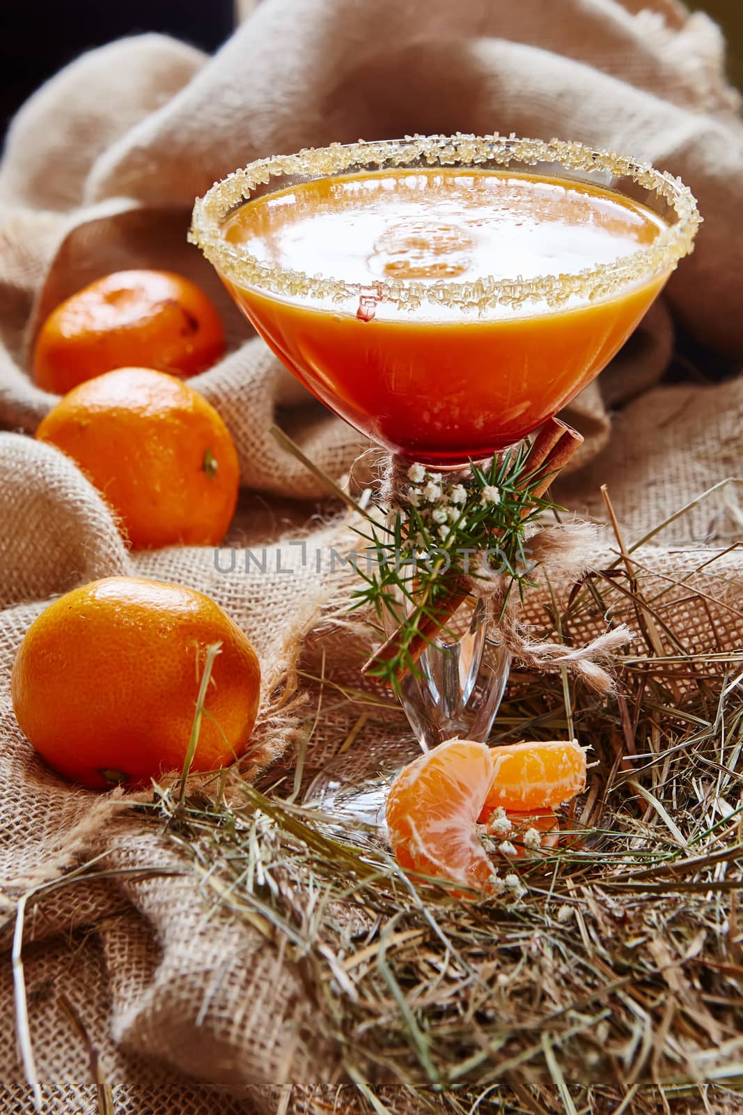 Fresh juice of ripe mandarins in glass. selective focus