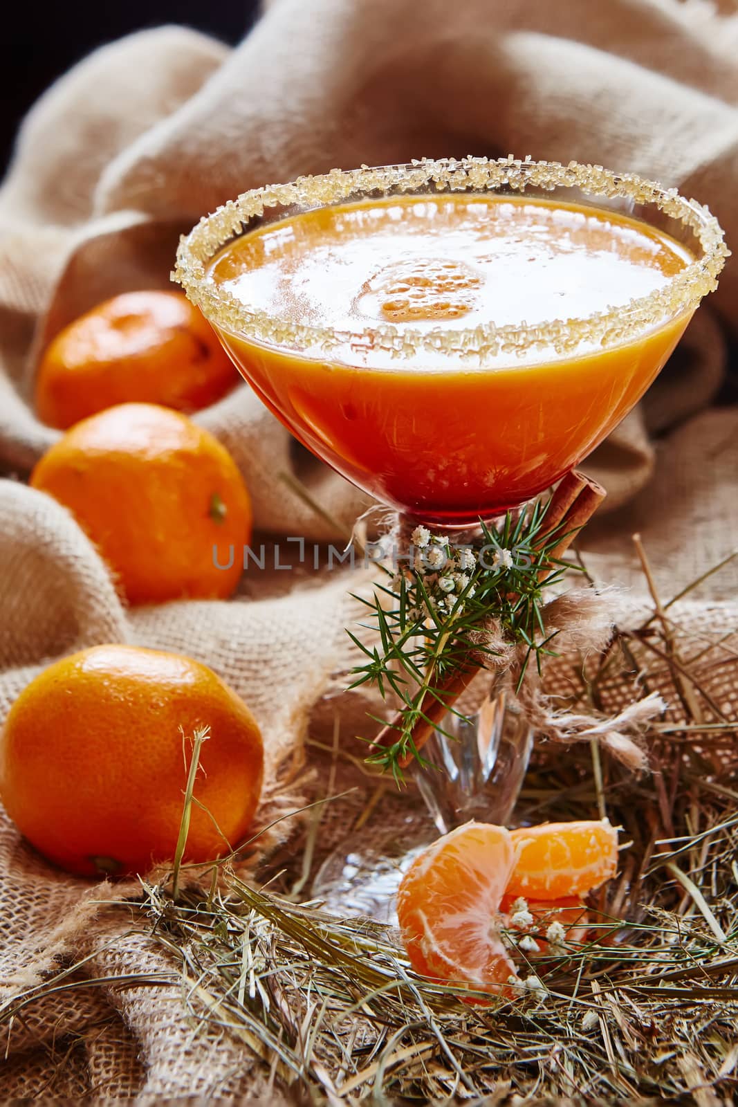 Fresh juice of ripe mandarins in glass. selective focus