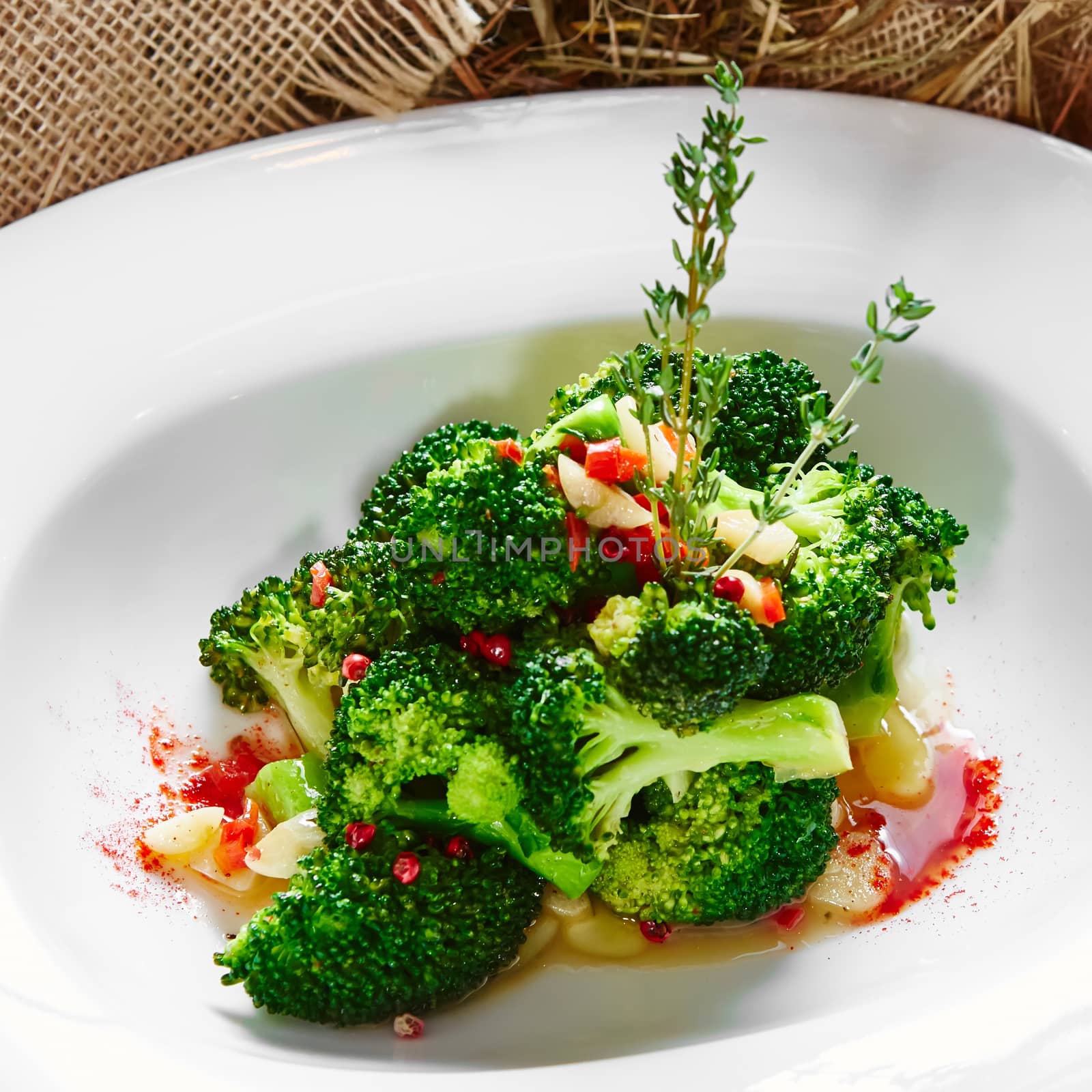 boiled broccoli in white bowl on table