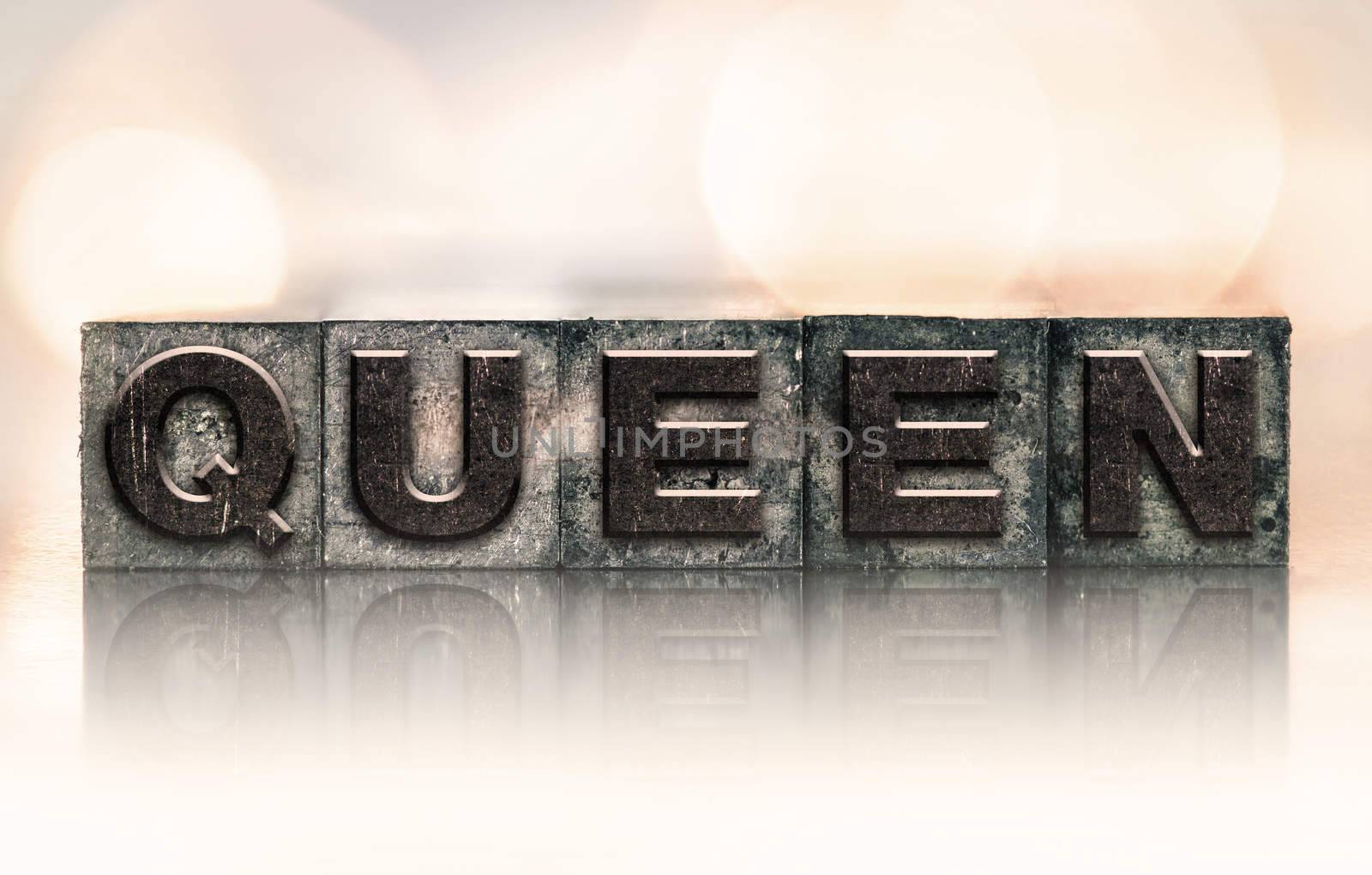 The word "QUEEN" written in vintage ink stained letterpress type.