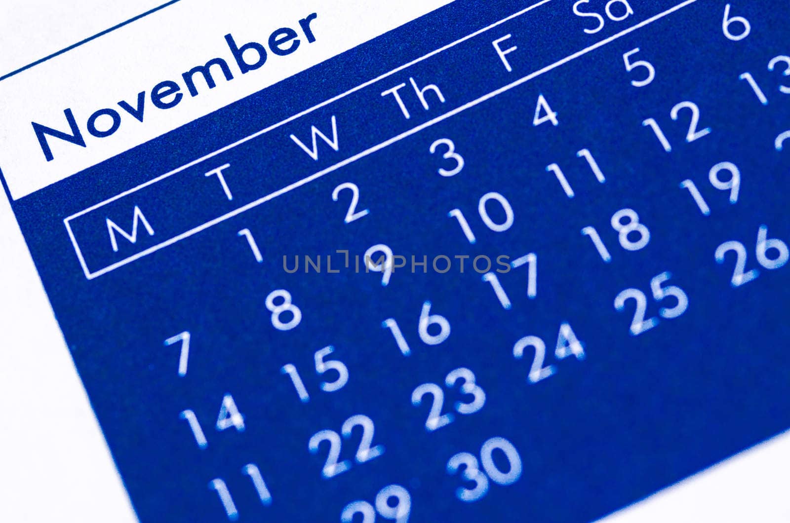 Close up of spiral bound calendar displaying month of November.