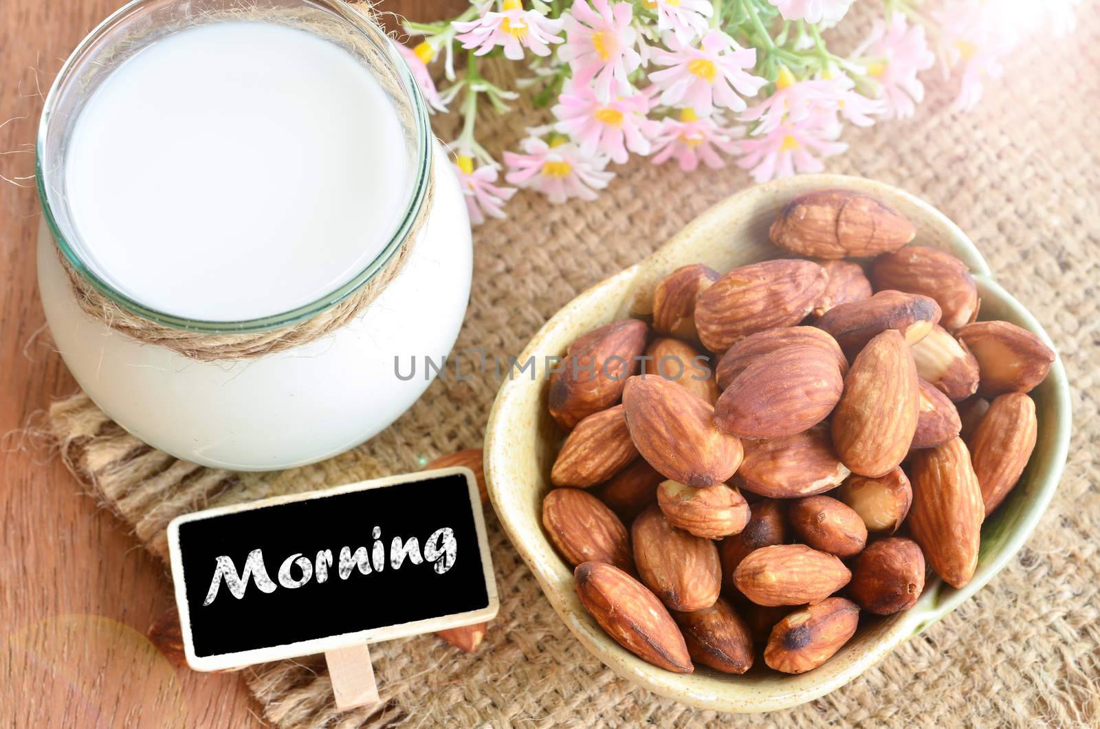 Almond milk in glass with morning tag.