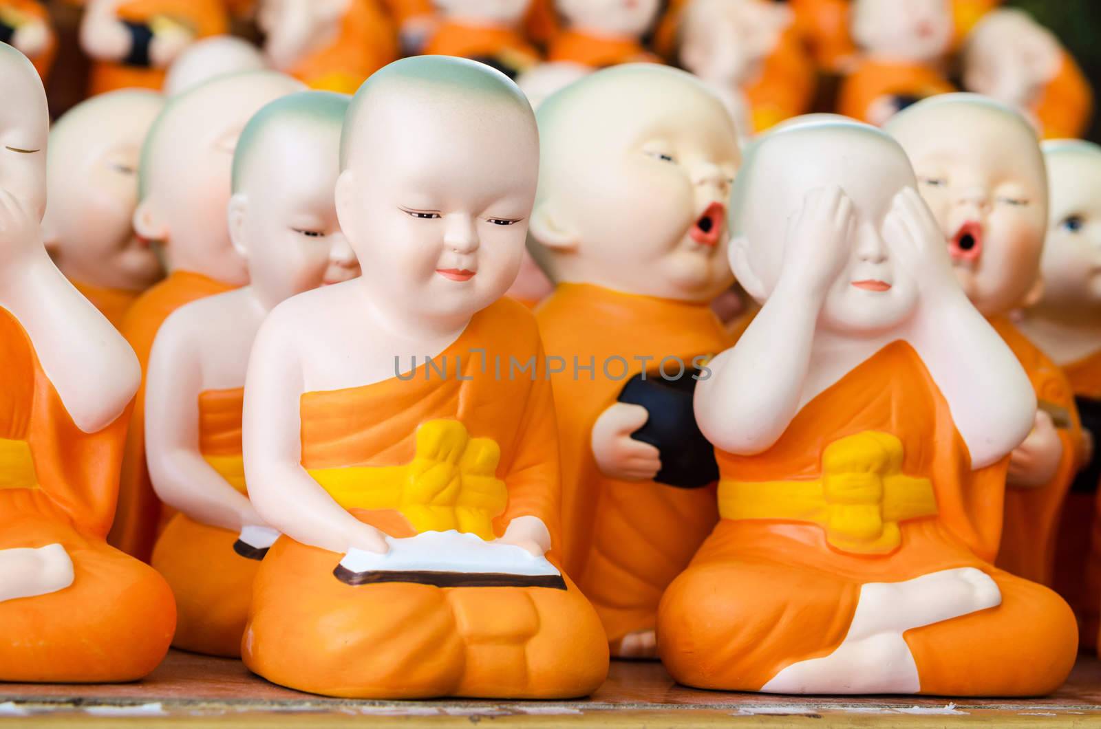 Many ceramic monk doll at temple in Thailand.