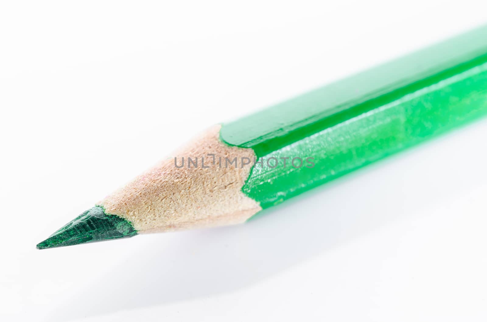 Green colouring crayon pencil isolated on white background