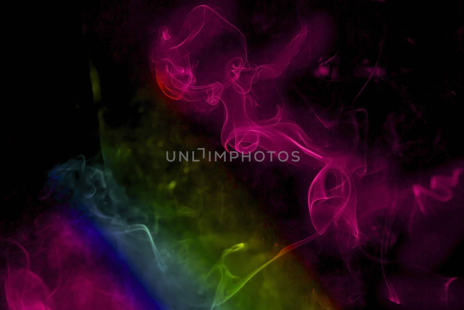 Colorful incense smoke, abstract shape on black background