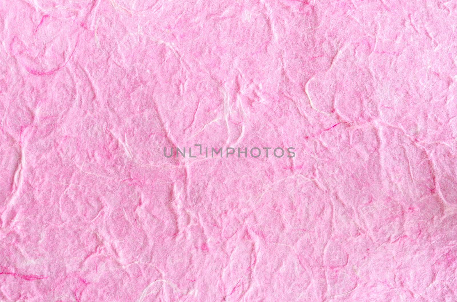 Pink paper background with fiber structure. by Gamjai