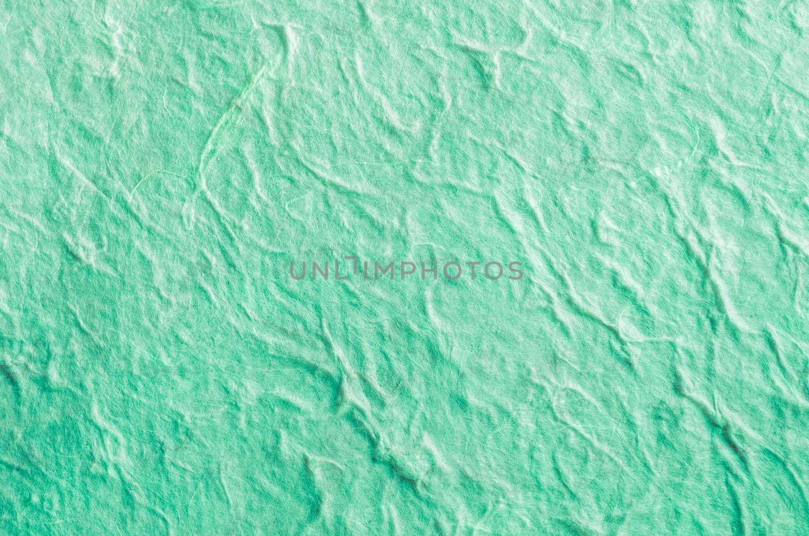 green paper background with fiber structure. Recycle paper.