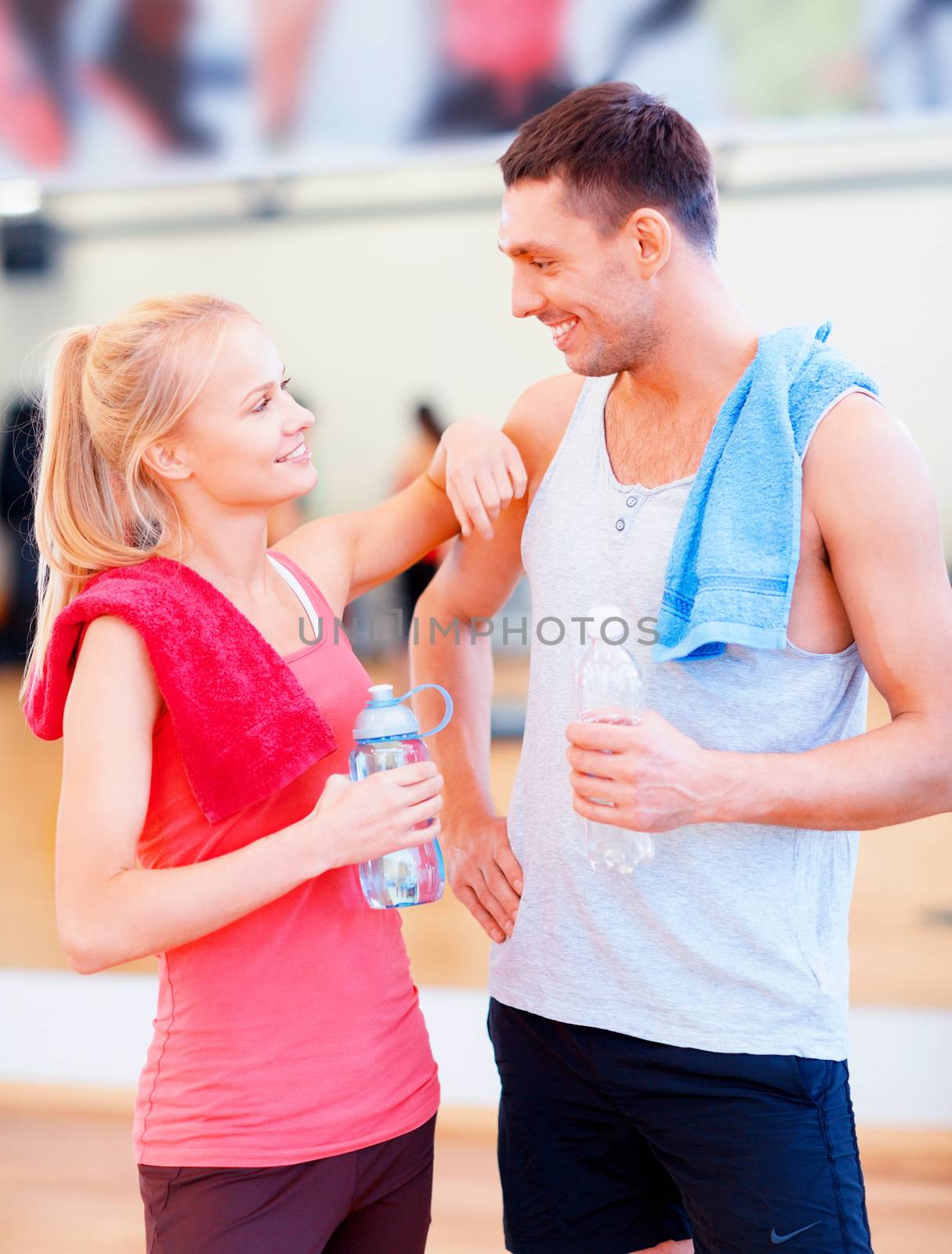 two smiling people in the gym by dolgachov