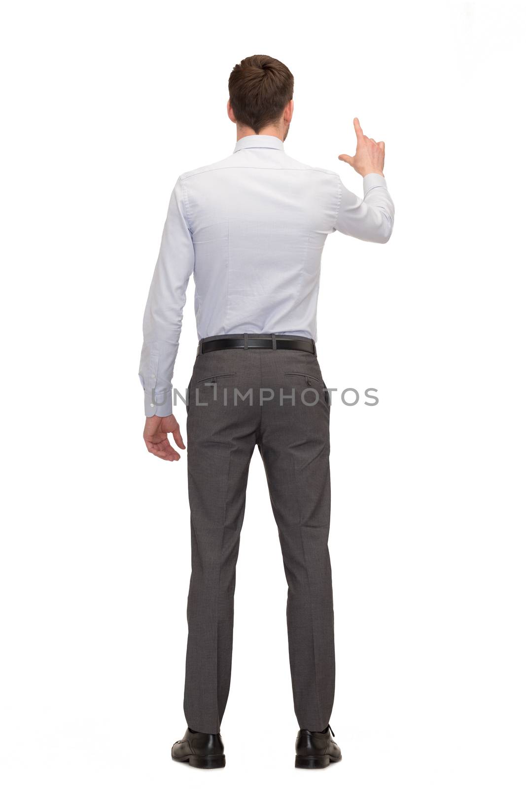 business, education and office concept - businessman or teacher pointing on something from back