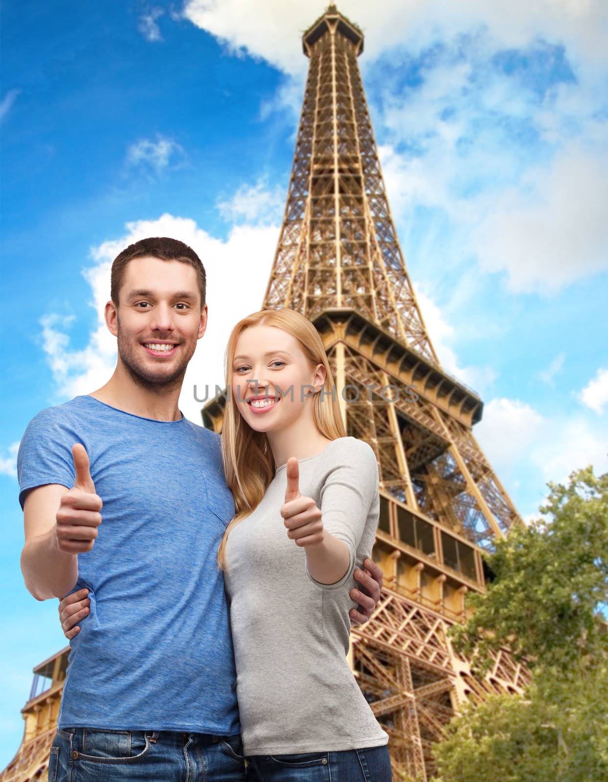 smiling couple showing thumbs up by dolgachov