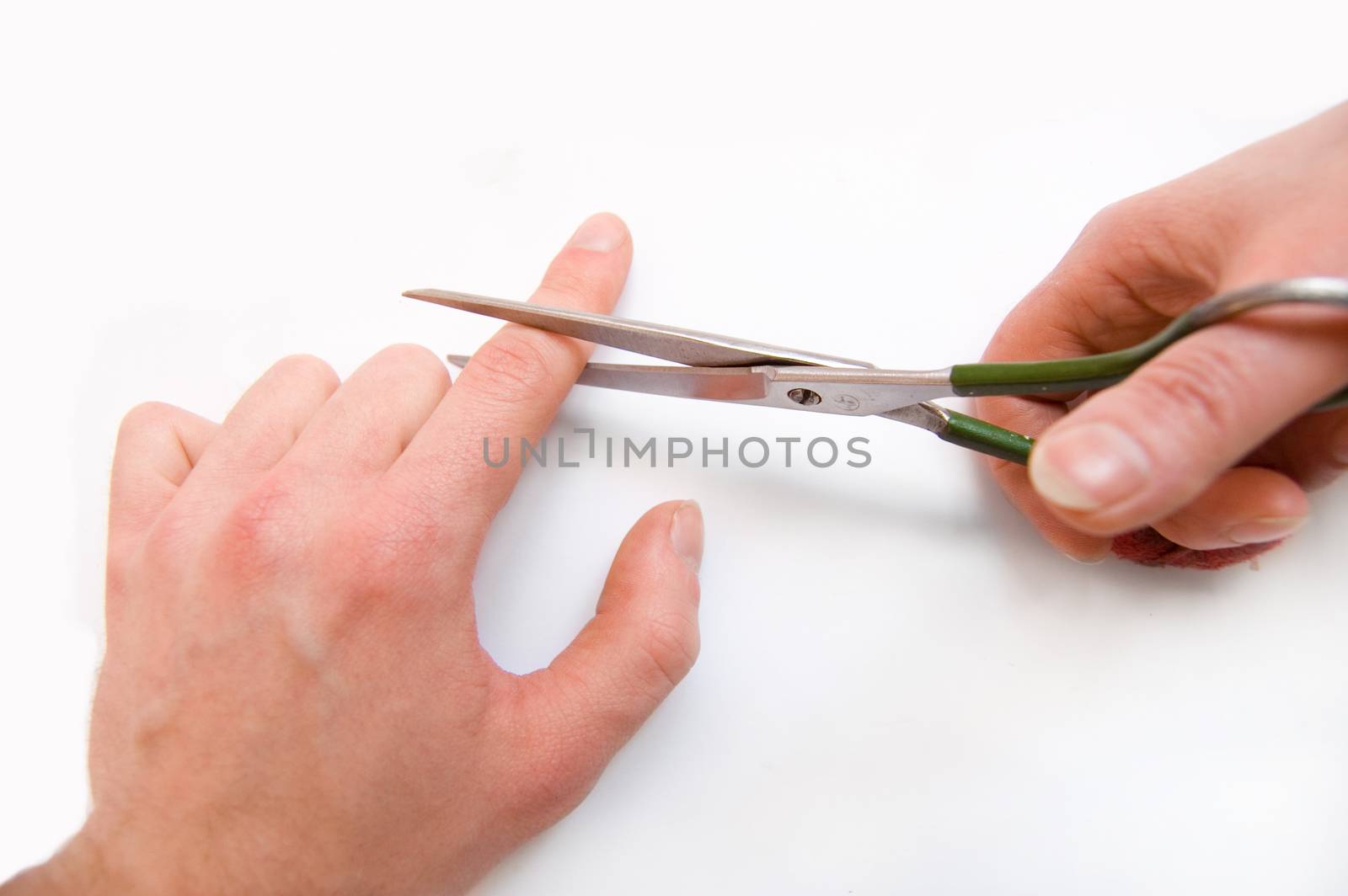 Contraception conceptual image. Contraception symbolic concept with scissors cut-off finger.