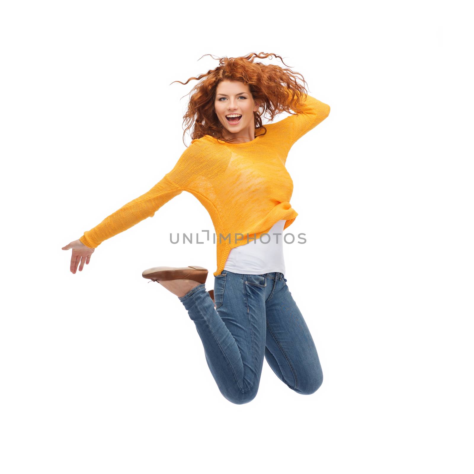 smiling young woman jumping in air by dolgachov