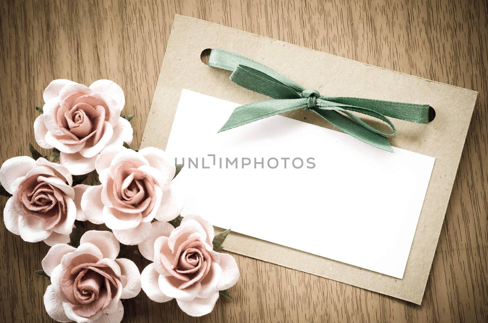 Vintage greeting card and rose flower. by Gamjai