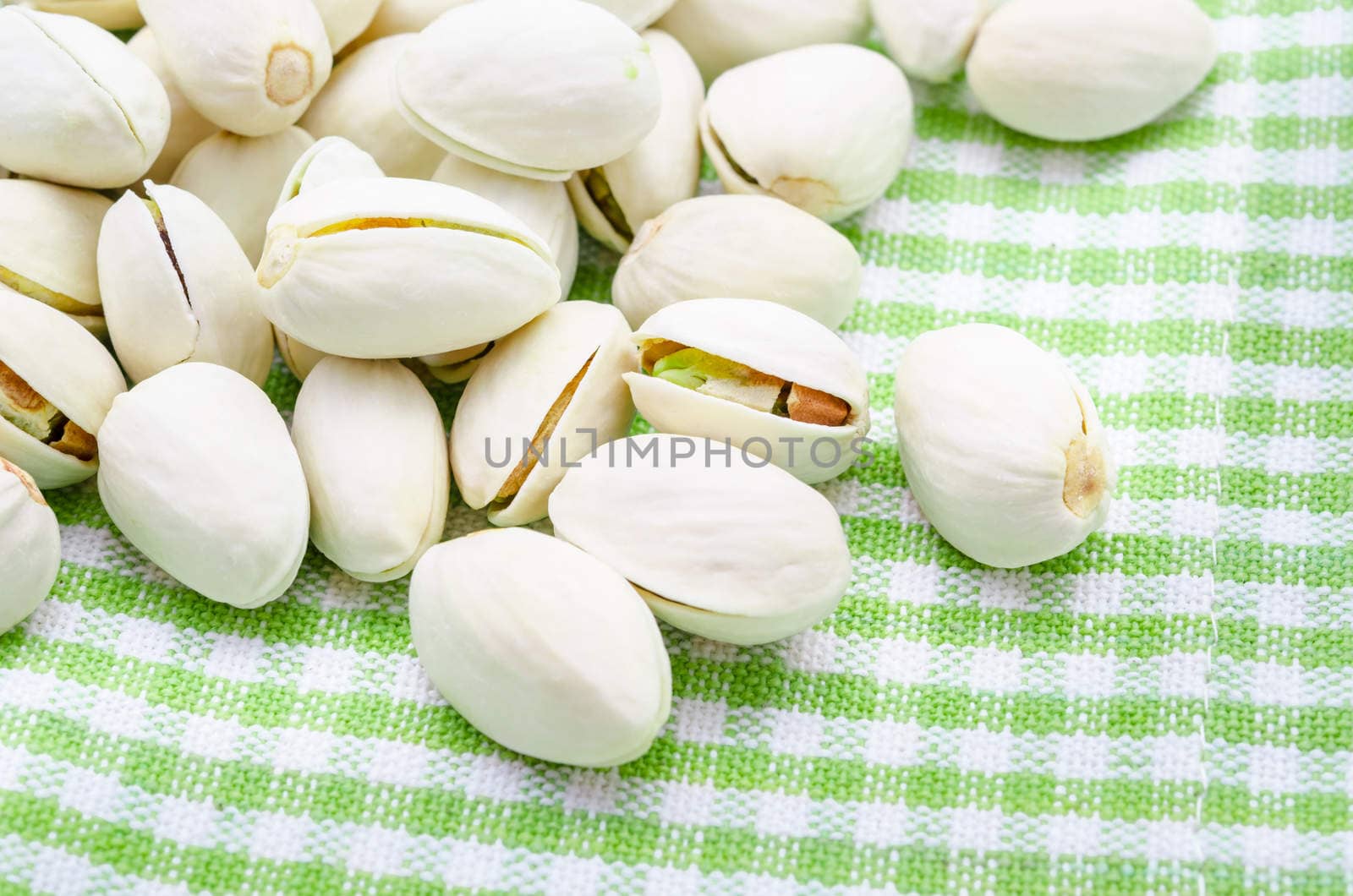 Pistachio nuts on checkered cloth