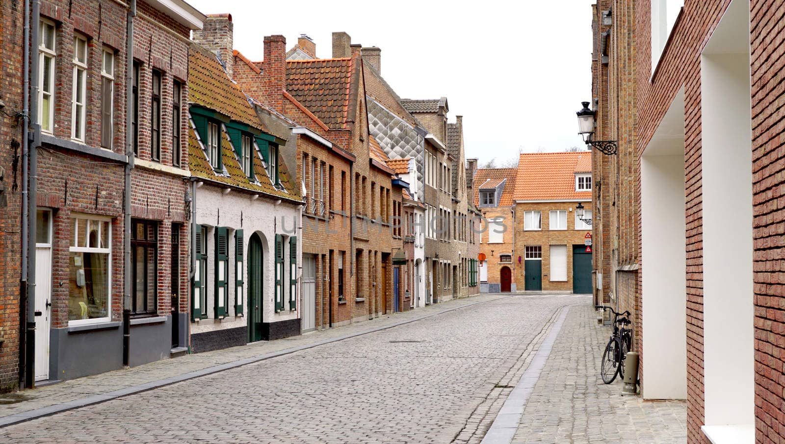 Old town city in Brugge Belgium by polarbearstudio