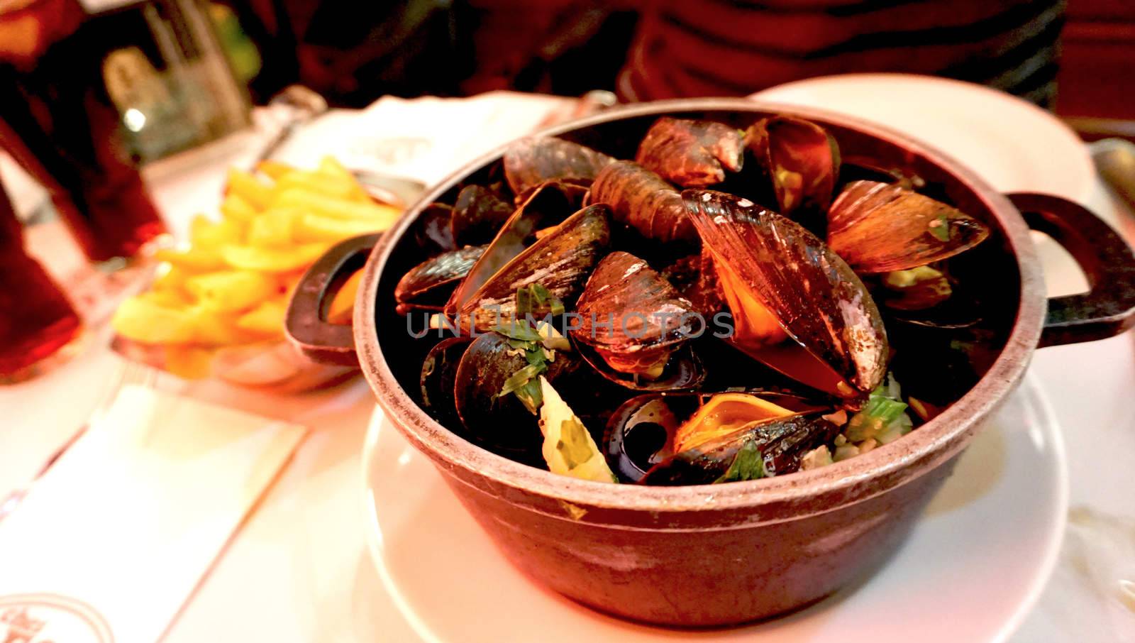 baked mussels with white wine with frenchfried in belgium